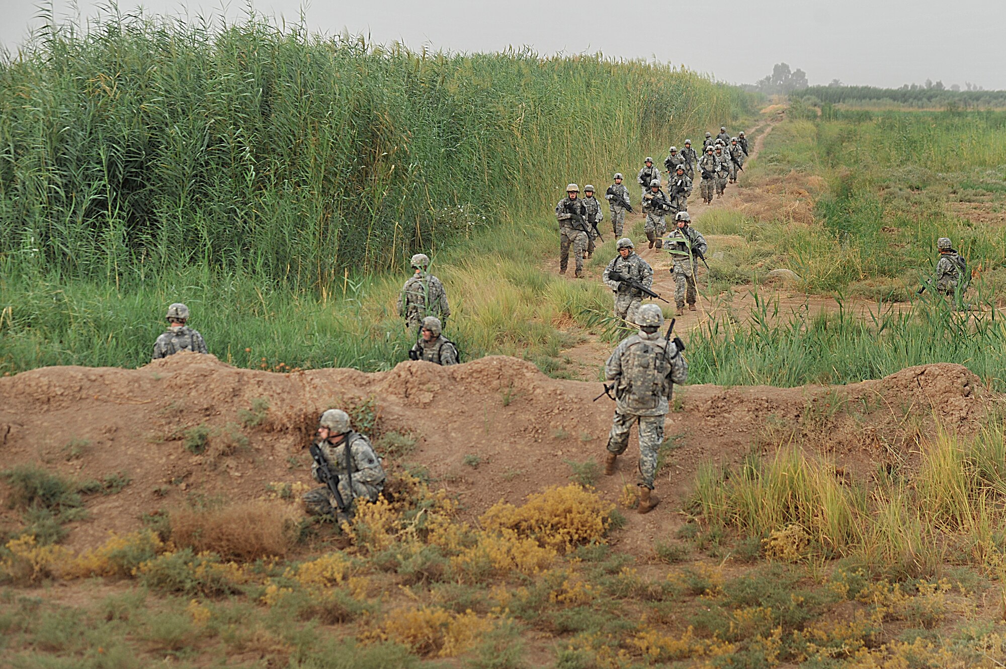 Soldiers and Airmen patrol the perimeter of Joint Base Balad, Iraq during Operation Lewis and Clark Sept. 11. Operation Lewis and Clark was a joint patrol in which Air Force security forces Airmen were introduced to Balad's outer perimeter. Since Americans began operating from Balad in 2003, the Army has been responsible for base security. The 332nd Expeditionary Security Forces Group will soon be the largest security forces unit deployed in combat to defend an airbase since Vietnam. 
(U.S. Air Force photo by Staff Sgt. Aaron Allmon) 
