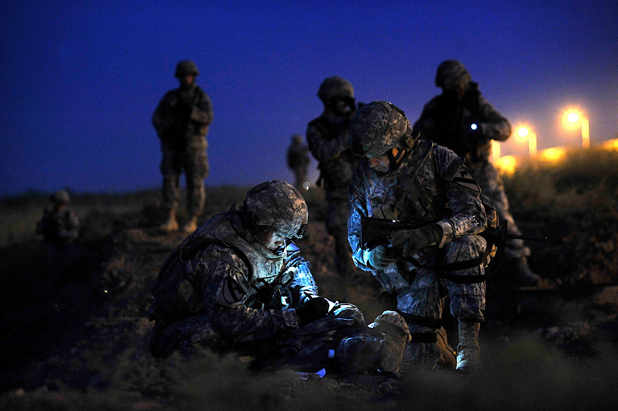 Second Lieutenant Chang Ahn, 5th Battalion 82nd Field Artillery 2nd Platoon leader,and Major David McCulley, 5th Battalion 82nd Field Artillery Battalion operations officer, update perimeter maps to increase base security during Operation Lewis and Clark Sept. 11 at Joint Base Balad, Iraq.  Operation Lewis and Clark was a joint patrol in which Air Force security forces Airmen were introduced to Balad's outer perimeter. Since Americans began operating from Balad in 2003, the Army has been responsible for base security. The 332nd Expeditionary Security Forces Ground will soon be the largest security forces unit deployed in combat to defend an airbase since Vietnam. (U.S. Air Force photo by Staff Sgt. Aaron Allmon) 
