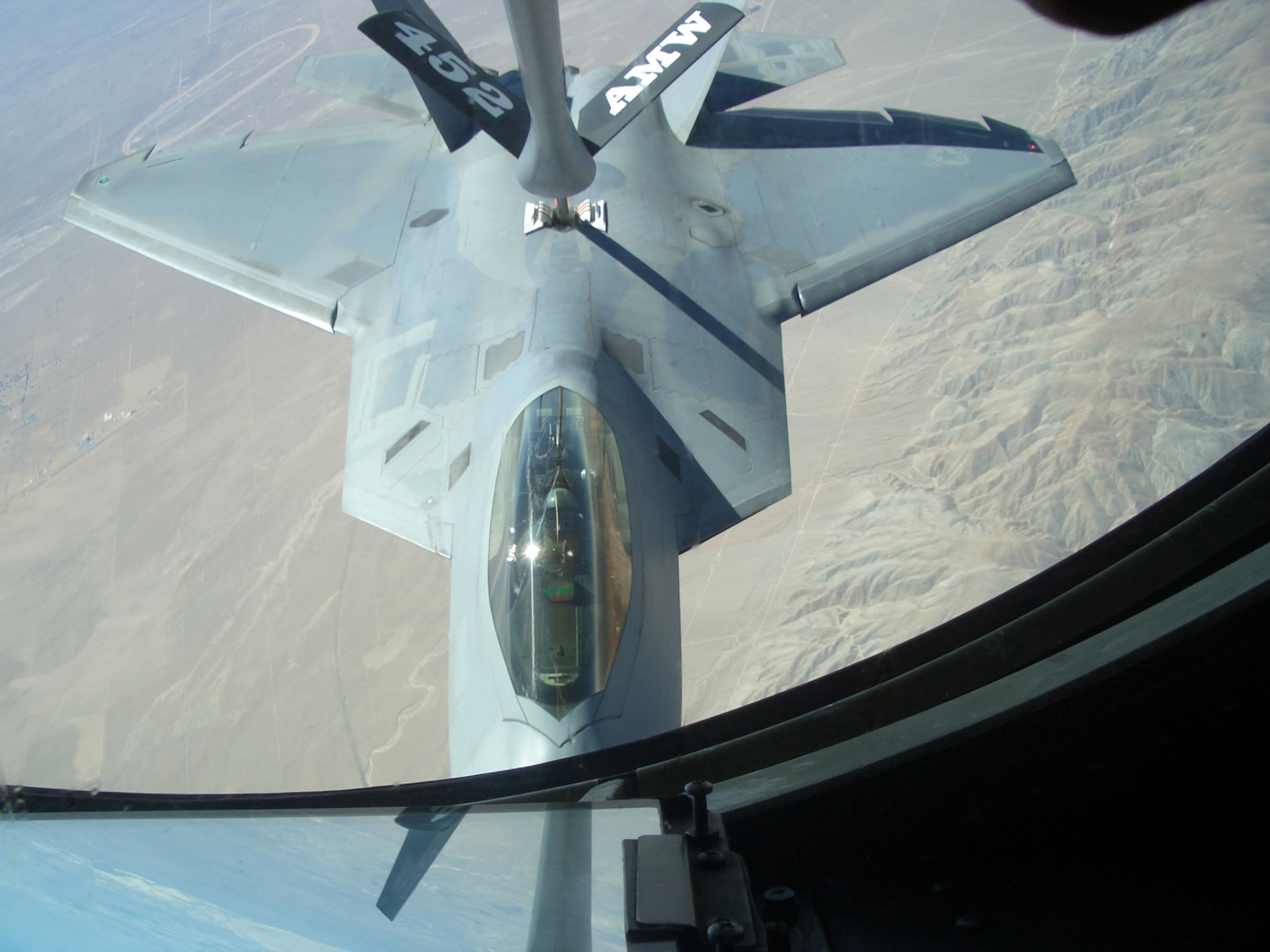 8/29/2008 - EDWARDS AIR FORCE BASE, Calif. ? An F-22 Raptor receives synthetic fuel from a KC-135 Stratotanker during an Aug. 28 aerial refueling test using alternative jet engine fuel. The fuel is a 50/50 mix of JP-8 jet fuel and a natural gas-based fuel. The test was done as part of the Secretary of the Air Force?s initiative to certify the entire fleet on synthetic fuel, an effort to lessen foreign dependence on oil. The F-22 is from Edwards AFB, Calif., while the KC-135 is from March Air Reserve Base, Calif. (Photo courtesy of Lockheed Martin)
