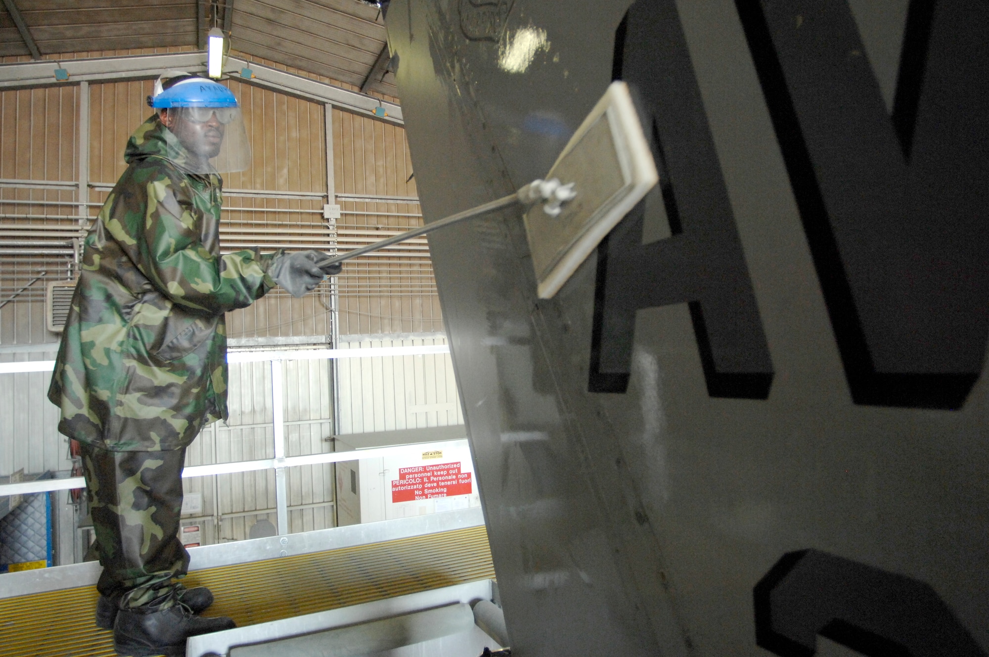 Airman 1st Class Tommy Ellerbe, 31st Aircraft Maintenance Squadron, scrubs an F-16 in the base wash rack Sept.9. The Aviano F-16 fleet is routinely washed every six months or as needed to maintain professional looking and corrosion-free aircraft.  (U.S. Air Force photo/Airman 1st Class Ashley Wood)