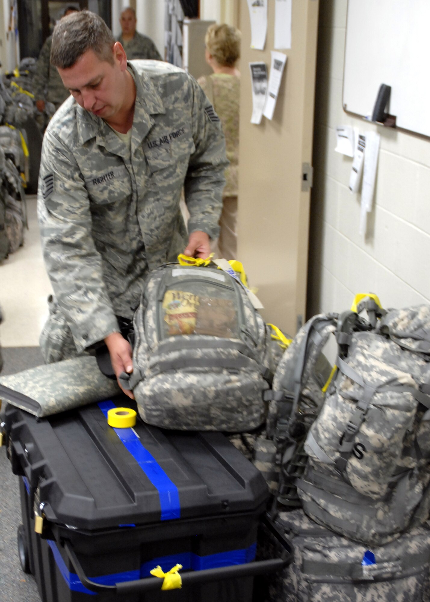 WRIGHT-PATTERSON AFB, Ohio - U.S. Air Force Tech. Sgt. Gale Righter Jr., 445th Civil Engineer Squadron, packs his gear for deployment before departing for a six-month deployment to Southwest Asia on Tuesday, September 9, 2008.  Sergeant Righter is part of a sixty member team from the 445th Airlift Wing that will be deployed to Southwest Asia for the next six months providing construction support. (U.S. Air Force photo/Tech. Sgt. Charlie Miller)