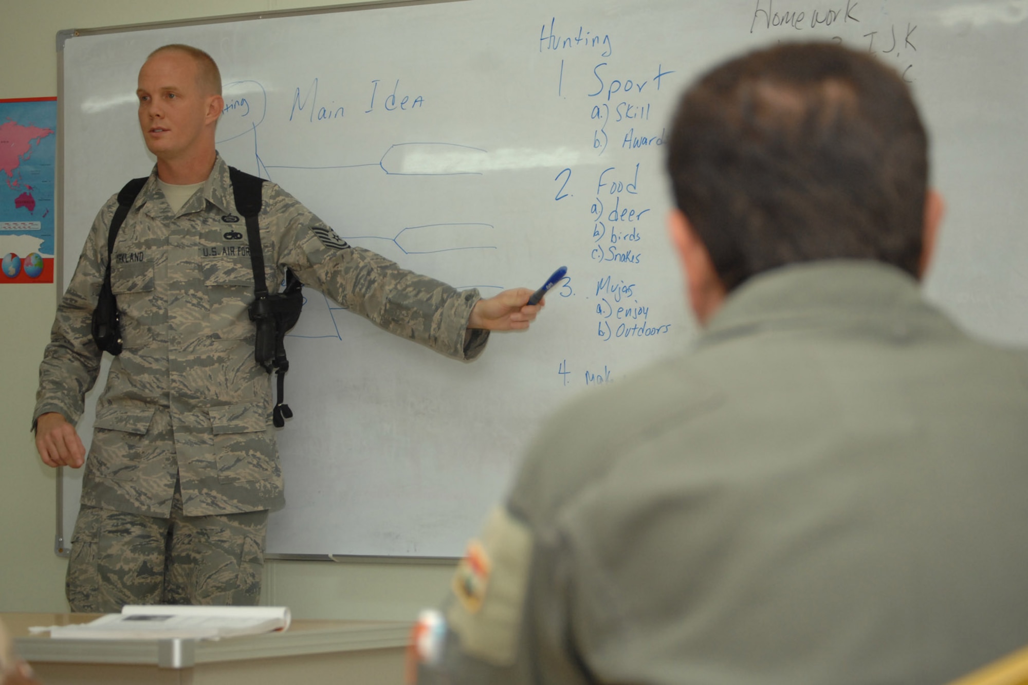 KIRKUK REGIONAL AIR BASE, Iraq -- Tech. Sgt. Keith Kirkland, 870th Air Expeditionary Advisory Squadron American Language Course NCOIC and instructor, teaches an English class to Iraqi air force airmen here Sept 8.  The inaugural graduation ceremony for the ALC took place Sept 10.  The program was developed by Sergeant Kirkland and his three-man team to assist the Iraqi air force in achieving their fourth core value of learning the English language.  He is a training manager deployed from Buckley Air Force Base, Colo., and calls Avon Park, Fla., home. (U.S. Air Force photo/Senior Airman Randi Flaugh)
