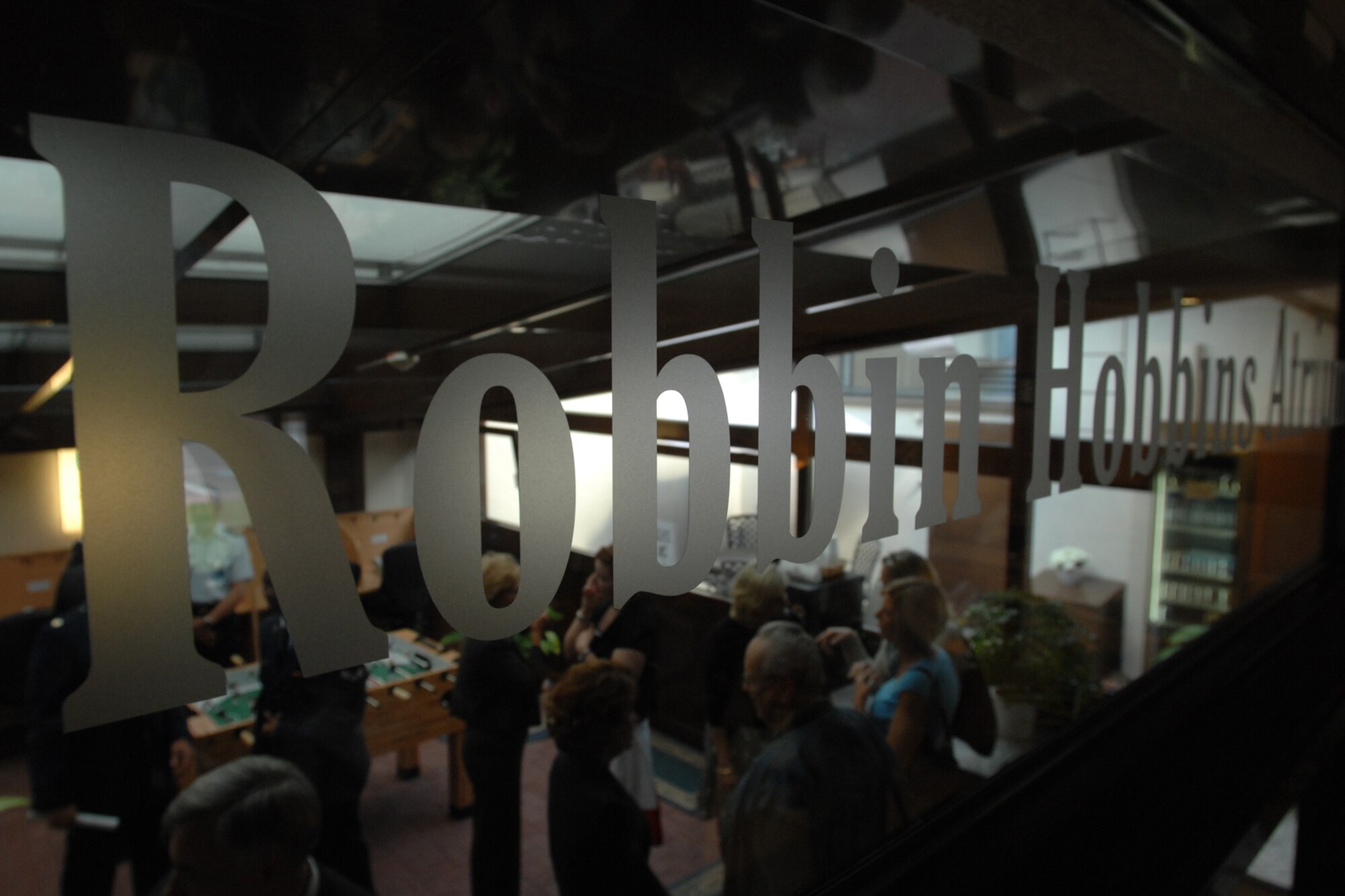 "Robbin Hobbins Atrium" is now etched into the window above the entrance to the atrium located in the Contingency Aeromedical Staging Facility USO.  During a ceremony Sept. 8 at Ramstein Air Base, Germany, the 435th Medical Group dedicated the CASF USO atrium to Mrs. Robbin Hobbins, wife of retired Gen. Tom Hobbins, for her devotion to making the lives of wounded warriors more comfortable.  All wounded personnel from Afghanistan and Iraq transit through this CASF facility. (U.S. Air Force photo by Senior Airman Amber Bressler)(RELEASED)

