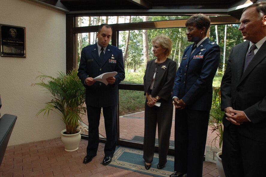 U.S. Air Force Maj. Paul Toth (left), 435th Aerospace Medical Squadron Contingency Aeromedical Staging Facility troop commander, speaks to Mrs. Robbin Hobbins (standing to his right), Col. Angela Thompson, 435th Medical Group commander, and retired Gen. Tom Hobbins at the USO atrium dedication ceremony Sept. 8 at Ramstein Air Base, Germany.  The 435th Medical Group dedicated the CASF USO atrium to Mrs. Hobbins for her devotion to making the lives of wounded warriors more comfortable.  All wounded personnel from Afghanistan and Iraq transit through this CASF facility. (U.S. Air Force photo by Senior Airman Amber Bressler)(RELEASED)