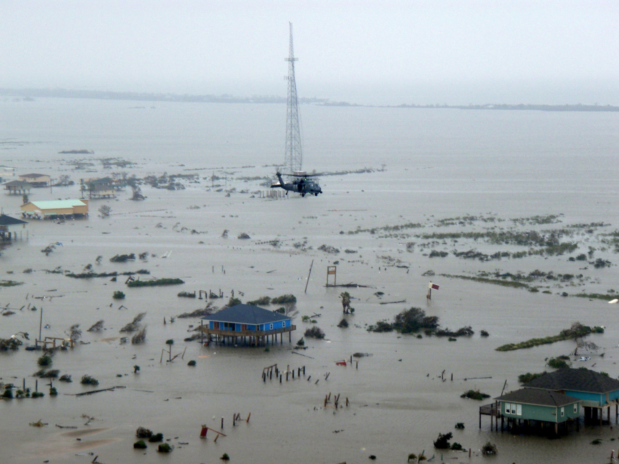 A Joint Task Force 129 crew on board an HH-60G Pave Hawk flies over Crystal Beach, Texas, Sept. 13. The JTF 129 crews rescued 48 people and pets stranded in the Galveston area. (U.S. Air Force photo/Tech. Sgt. Luigge Romanillo) 
