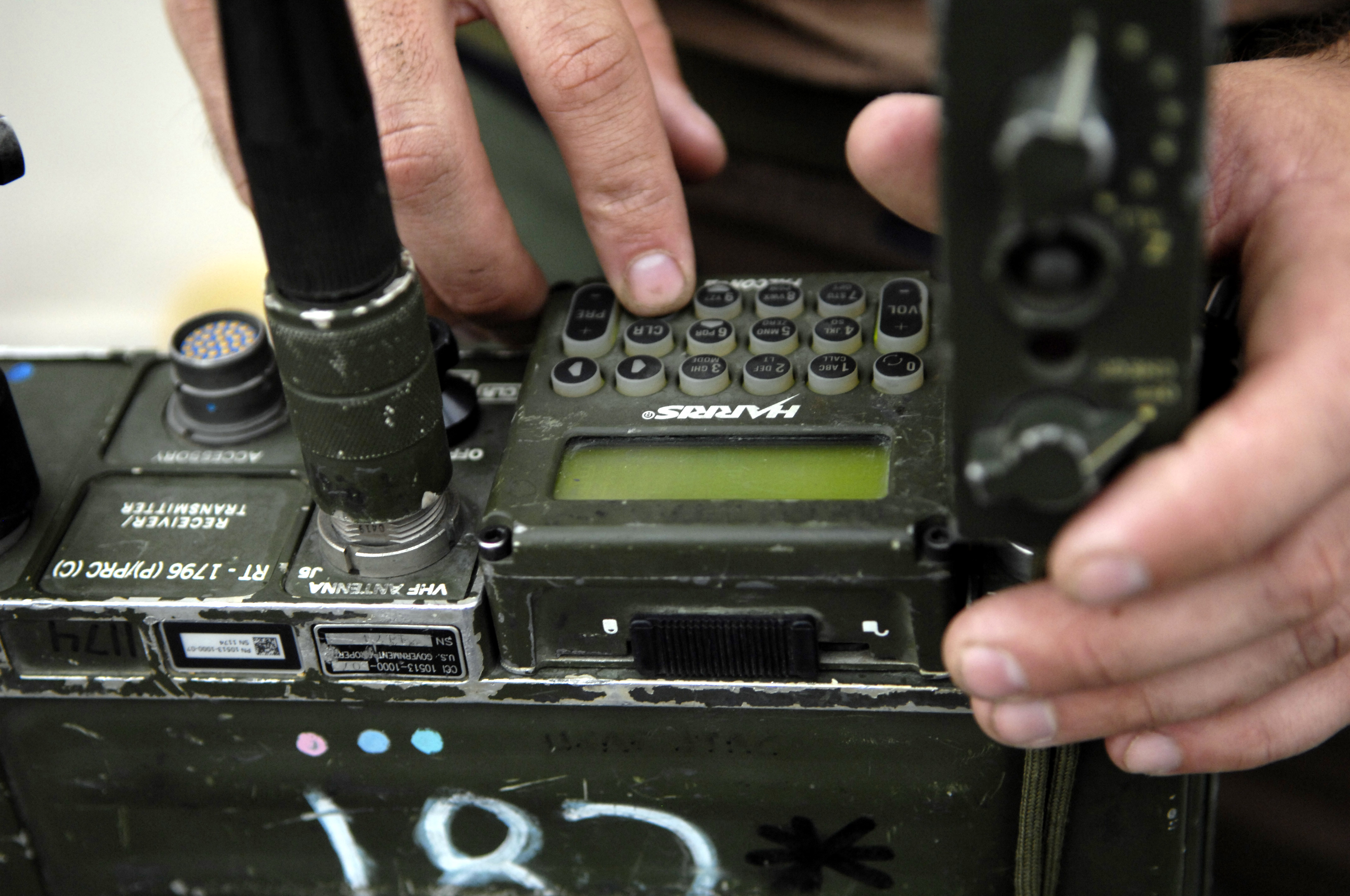 U.S. Air Force Tech. Sgt. Larry Knoll Programs Radio Frequencies To A ...