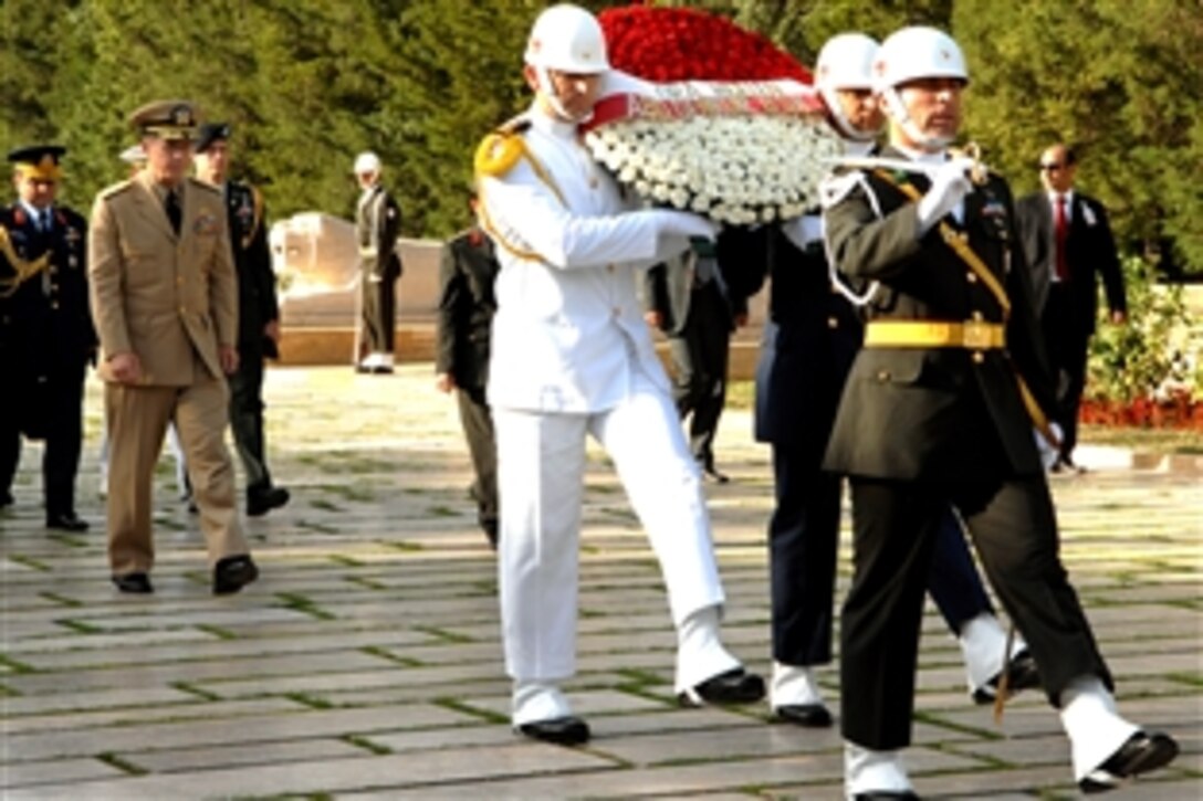 Chairman of the Joint Chiefs of Staff U.S. Navy Adm. Mike Mullen walks behind a procession of Turkish military troops carrying a ceremonial wreath at Anitkabir in Ankara, Turkey, Sept. 15, 2008. Mullen laid a wreath at the mausoleum of Mustafa Kemal Ataturk, the country's first president. 