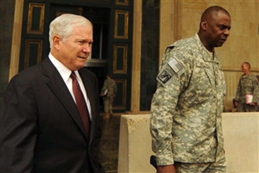 U.S. Army Lt. Gen. Lloyd Austin III escorts Defense Secretary Robert M. Gates out of the Al Faw Palace on Camp Victory, Iraq, Sept. 15, 2008. 