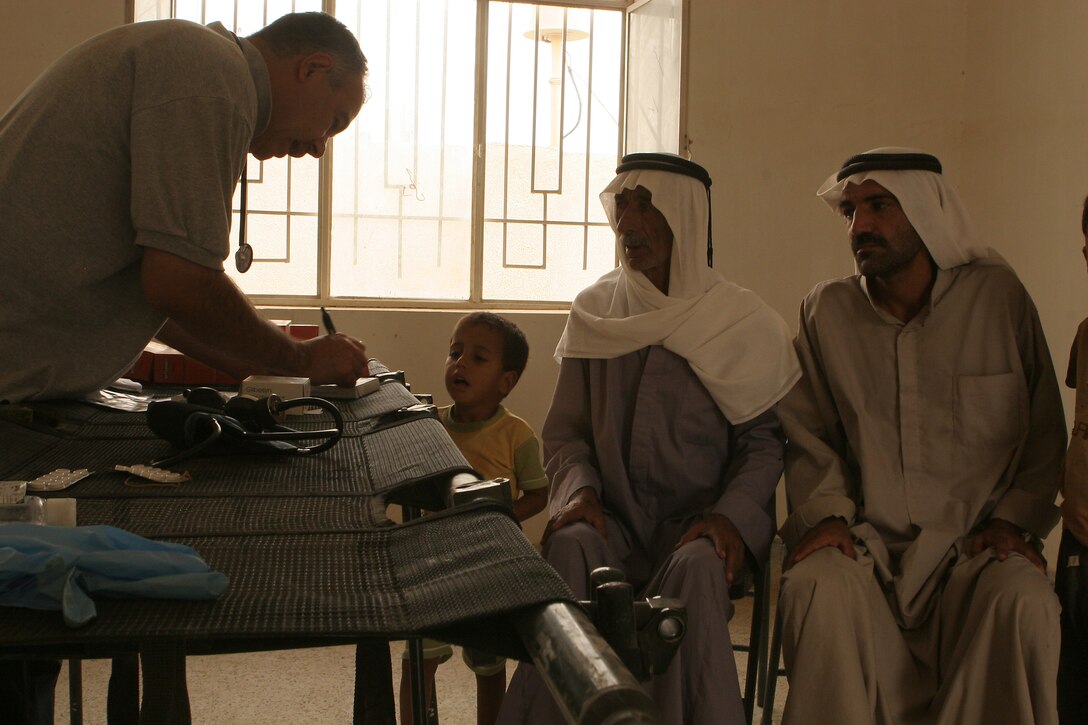 KARMAH, Iraq- An Iraqi doctor prescribes medication during a combined medical engagement Sept. 15. The CME was held by Weapons Company, Task Force 1st Battalion, 3rd Marine Regiment, Regimental Combat Team 1, in the West Karmah region. (Photo by Lance Cpl. Achilles Tsantarliotis)