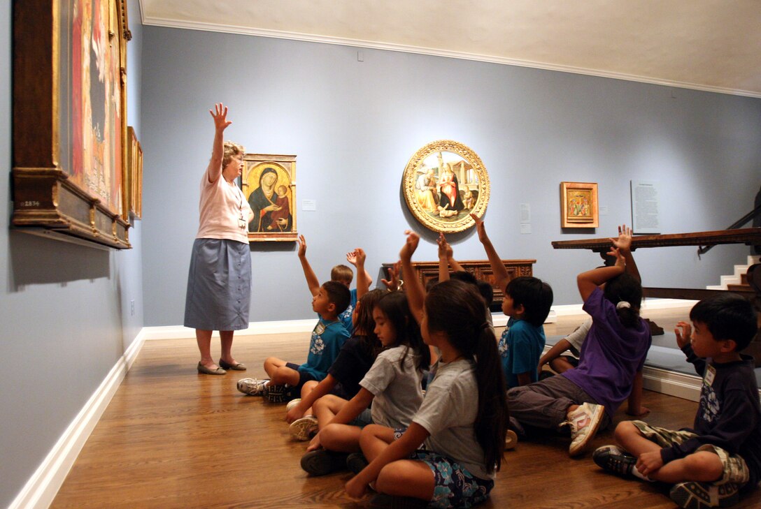 Carolyn Whitney, museum docent, interacts with children from Kapolei Elementry Shool during a school tour of the museum at the Honolulu Academy of Art Sept. 16. School tours must be scheduled ahead of time, but are longer and involve hands on activities, benchmarks and exploration for the children.