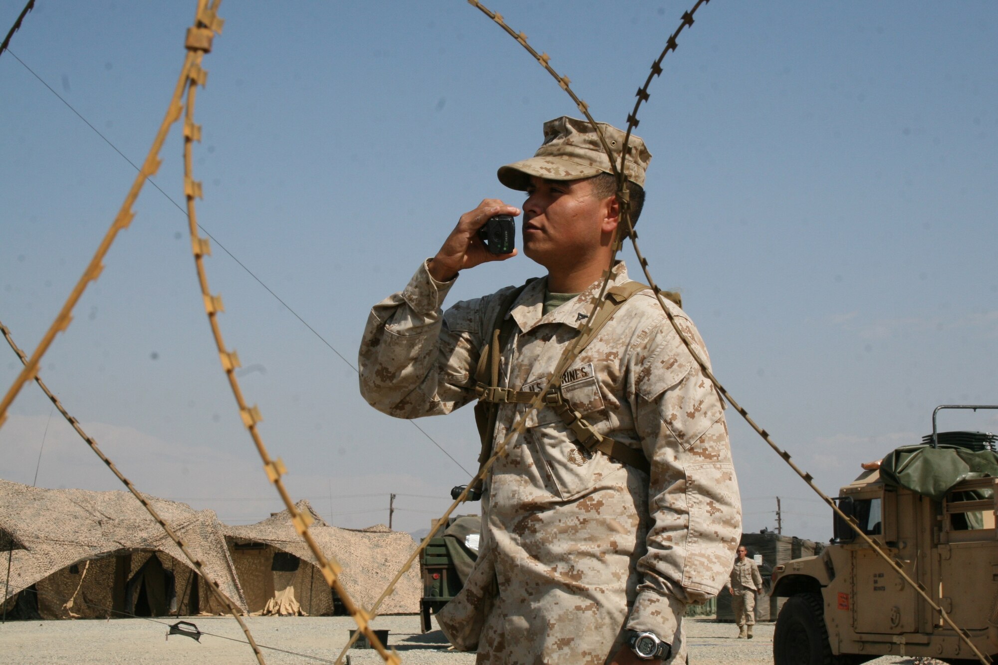 Lance Cpl. Jose R. Hurtado, an administrative clerk with the 13th Marine Expeditionary Unit, Camp Pendleton, conducts a radio check as part of the “Camp Cardiac” camp guard force based at March Air Reserve Base. He is part of a detachment of Marines and Sailors who are conducting Training in an Urban Environment (TRUE) Sept. 8 - 19 in the March ARB, Riverside, Los Angeles and
Big Bear areas. The purpose of the exercise is to train and evaluate the combat readiness of the 13th MEU before it deploys. The MEU trains in unfamiilar locations to better prepare Marines and Sailors for deployment. TRUE consists of three situational training exercises that involve the MEU’s command and support staff, Marine Special Operations Company operators, and aviation assets to execute reconnaissance and surveillance followed by direct action. (U.S. Marine Corps photo by Staff Sgt. Matthew Holly)