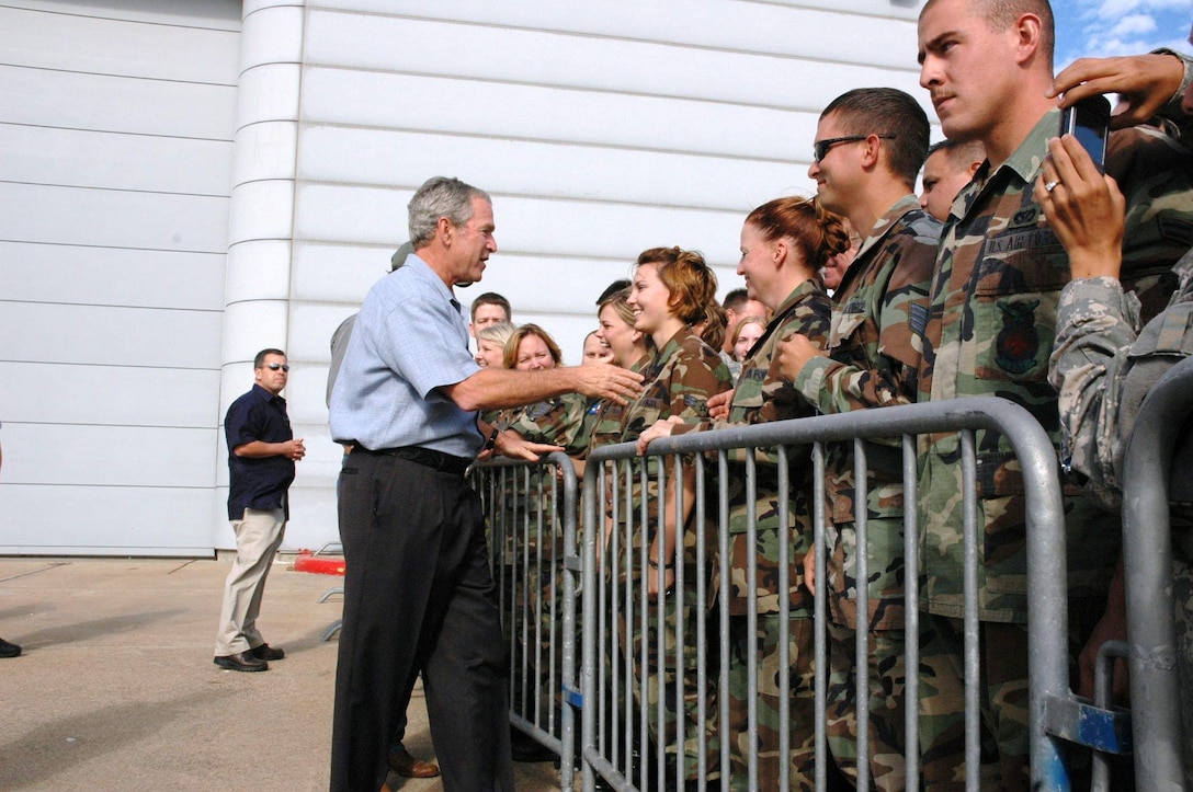 President George W. Bush shakes hands with military members Sept. 16 at Ellington Field, Texas, before assessing the damage from Hurricane Ike from the Marine 1 helicopter around the Gulf Coast. Active duty, Reserve and Guard servicemembers are assisting with the relief effort after the storm ravaged the region. (U.S. Air Force photo/Senior Master Sgt. Marcus Falleaf) 