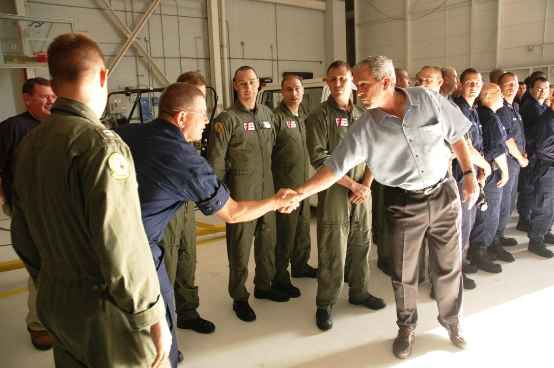 President George W. Bush shakes hands with military members Sept. 16 at Ellington Field, Texas, before assessing the damage from Hurricane Ike from the Marine 1 helicopter around the Gulf Coast. Active duty, Reserve and Guard servicemembers are assisting with the relief effort after the storm ravaged the region. (U.S. Air Force photo/Senior Master Sgt. Marcus Falleaf) 