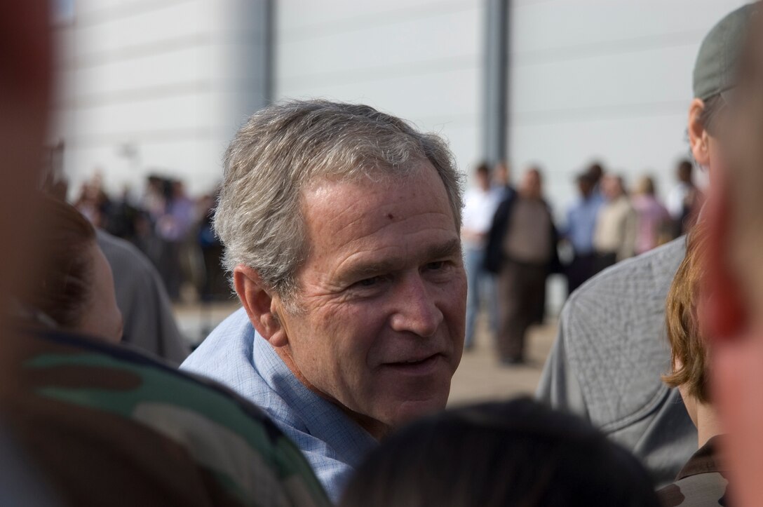President George W. Bush shakes hands with military members Sept. 16 at Ellington Field, Texas, before assessing the damage from Hurricane Ike from the Marine 1 helicopter around the Gulf Coast. Active duty, Reserve and Guard servicemembers are assisting with the relief effort after the storm ravaged the region. (U.S. Air Force photo/Tech. Sgt. Matthew McGovern) 