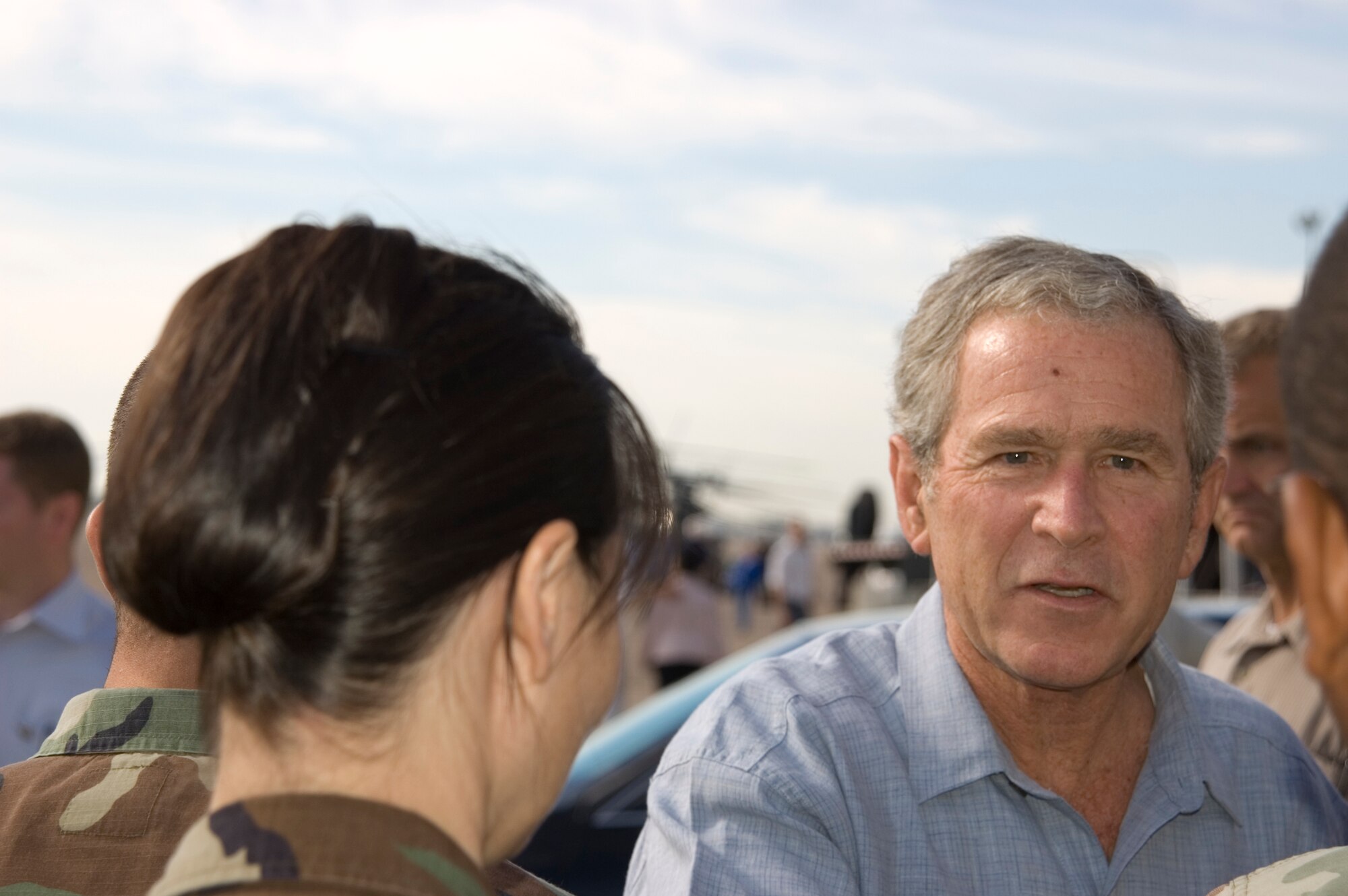 President George W. Bush shakes hands with military members Sept. 16 at Ellington Field, Texas, before assessing the damage from Hurricane Ike from the Marine 1 helicopter around the Gulf Coast. Active duty, Reserve and Guard servicemembers are assisting with the relief effort after the storm ravaged the region. (U.S. Air Force photo/Tech. Sgt. Matthew McGovern) 
