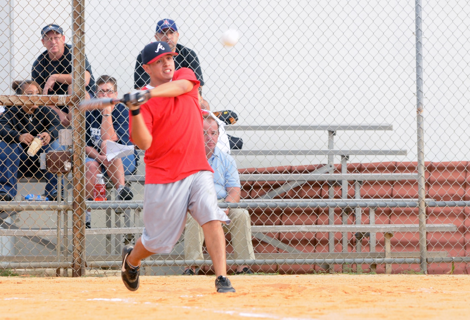 Elliott Ortiz, 12th Services Squadron intramural softball team second baseman, swings for the fences during the playoff game against the Air Force Occupational Measurement Squadron team on Monday at Rambler Field. (U.S. Air Force photo by Steve White)