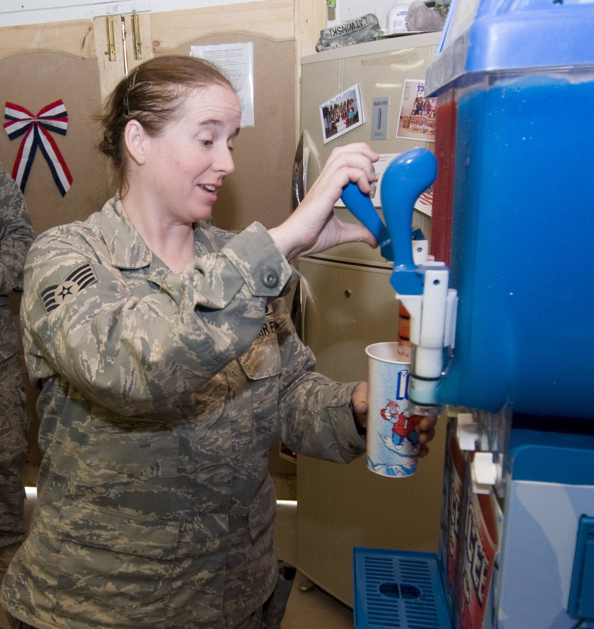 BAGRAM AIR FIELD, Afghanistan - Staff Sgt. Laura Dewey pours a slushy at forward operating base Mehtar Lam, Afghanistan, Sept. 7. The ICEE machine was donated by the Military Affairs Committee at Mountain Home, Idaho, for the Airmen deployed to Mehtar Lam. (U.S. Air Force photo/ Staff Sgt. Samuel Morse)