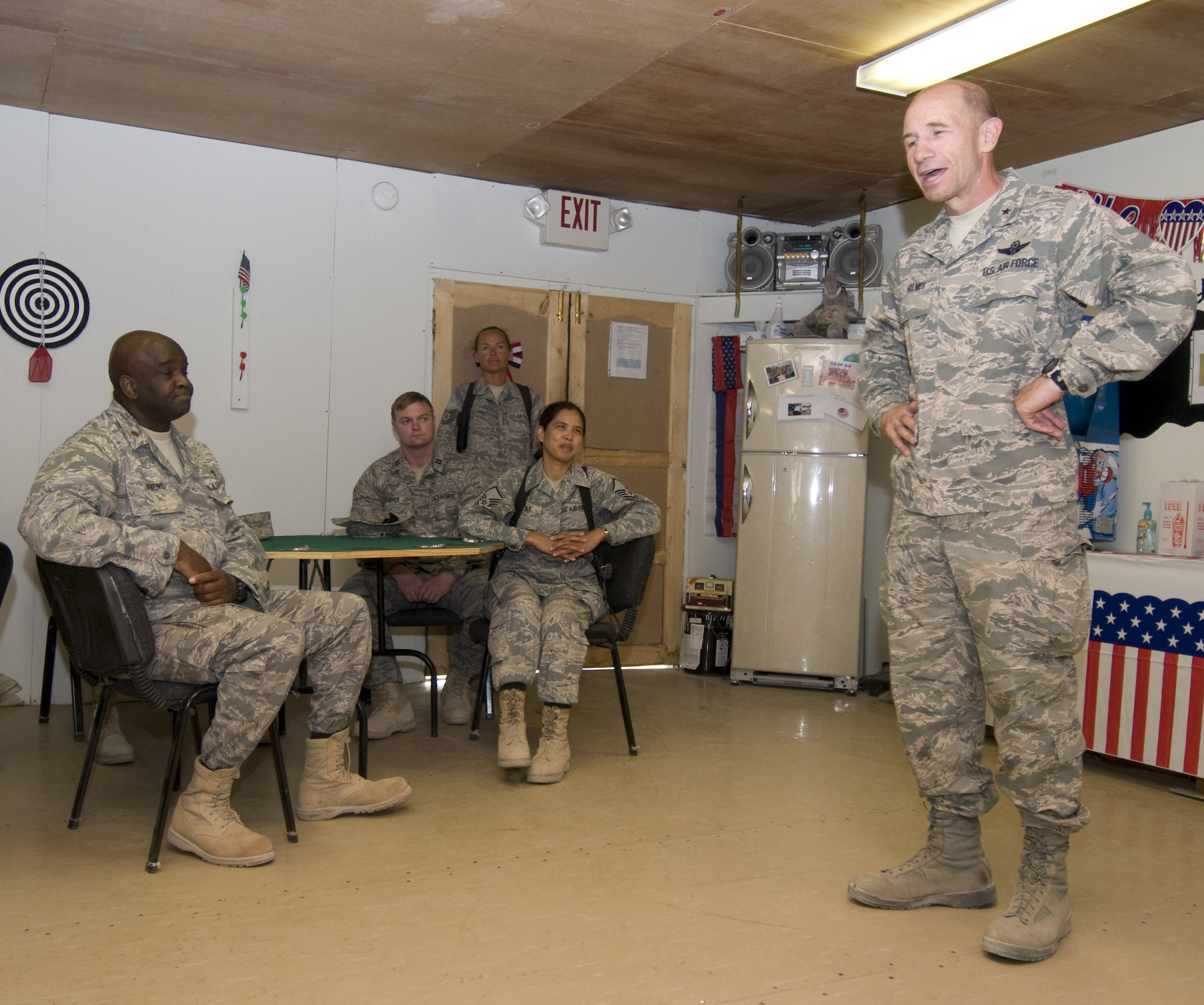 BAGRAM AIR FIELD, Afghanistan -- Brig. Gen. Mike Holmes, 455th Air Expeditionary Wing commander, speaks to the Airmen deployed to forward operating base Mehtar Lam, Afghanistan, in their recreation building Sept. 7. General Holmes visited Mehtar Lam in conjunction with delivery of an ICEE machine donated by the Military Affairs Committee at Mountain Home Air Force Base, Idaho. (U.S. Air Force photo/ Staff Sgt. Samuel Morse)
