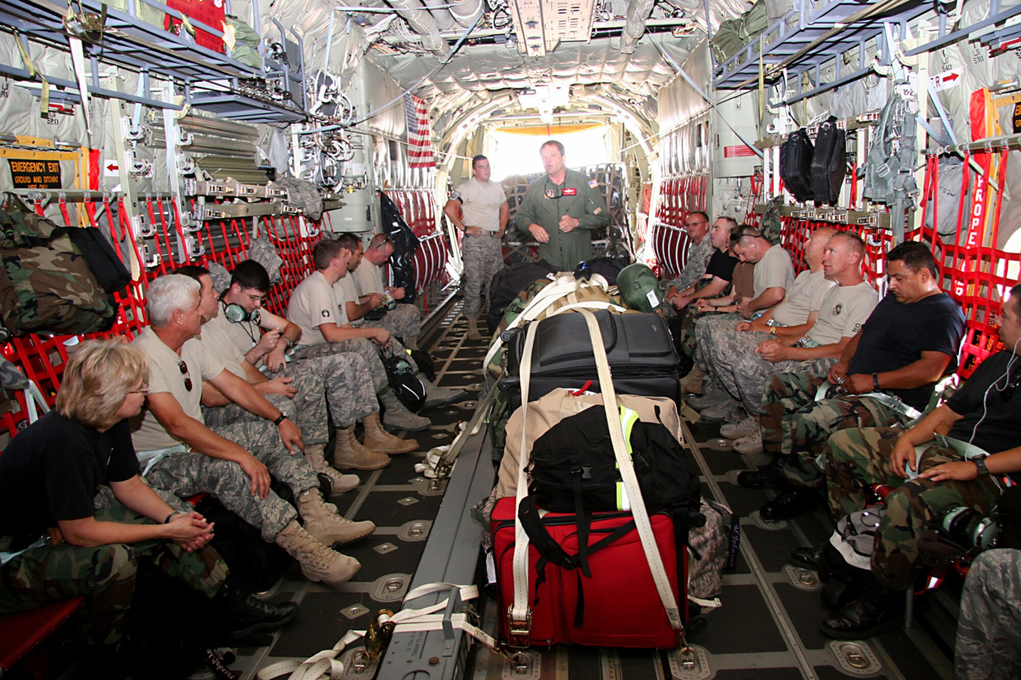 Seventeen Reservists from the 943rd Rescue Group deployed from Davis-Monthan Air Force Base, Ariz. Sept 13, 2008 on a C-130J Hercules Aircraft from the 815th Airlift Squadron from Keesler, Miss. to Randolph Air Force Base, Texas to assist with the search and rescue mission brought on by Hurricane Ike.  Senior Master Sgt. Larry Loeding, Air Force Reserve Command load master gives the Airmen a passenger briefing before departing D-M.  The Reservists are Airmen made up of various specialists, aircraft mechanics, intelligence specialists, and ground radio specialists.  They deployed with two pallets of equipment to sustain the SAR missions.  Once at Randolph, they will become part of the 331st Air Expeditionary Group, a joint search and rescue unit of more than 400 personnel and about 20 Air Force and Coast Guard HH-60 helicopters and four HC-130 aircraft.  These Airmen will maintain the helicopters, provide situational awareness to the aircrews in flight, and manage the ground to air communications.  (U.S. Air Force Photo/Master Sgt. Ruby Zarzyczny)