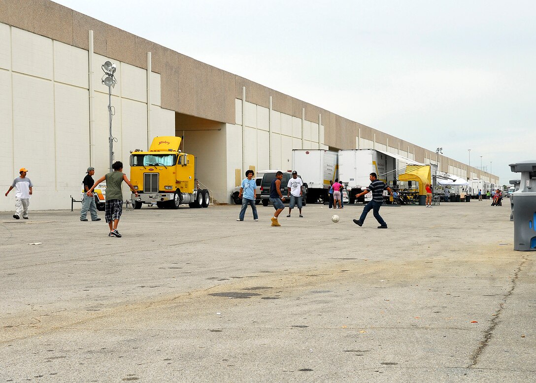 Evacuees of Hurricane Ike enjoy a game of soccer outside the shelter at Port San Antonio, San Antonio, Texas.  The shelter is housing over 4,000 evacuees and that number continues to increase. (US Air Force Photo by Staff Sgt. Andre’ Bullard)