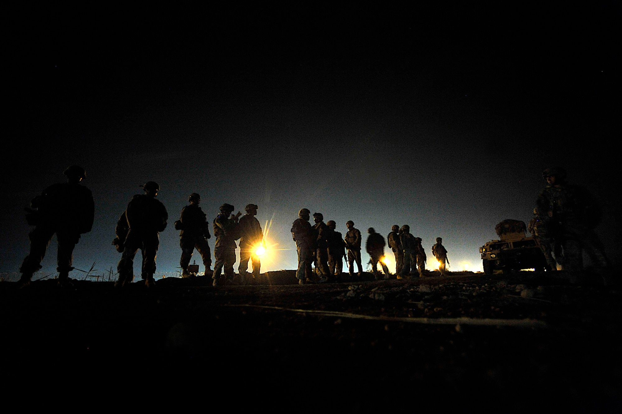 Airmen and Soldiers prepare for Operation Lewis and Clark Sept. 11 at Joint Base Balad, Iraq. Operation Lewis and Clark was a joint patrol in which Air Force security forces Airmen were introduced to Balad's outer perimeter, an area in which they will assume responsibility from the Army. (U.S. Air Force photo/Staff Sgt. Aaron Allmon)