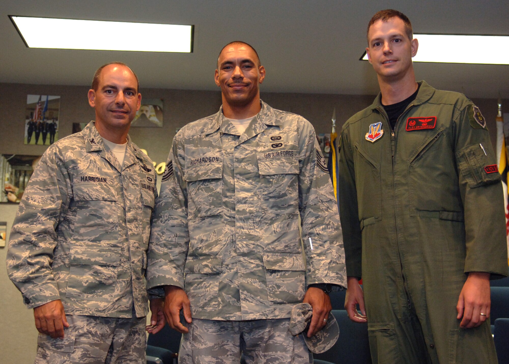Lt .Col.  Alexus Grynkewich, 49th Operation Support Squadron commander, congratulates Tech. Sgt.  Sascha Richardson, 49th Operations Support Squadron,  for a job well done after he returns home, September 3, at Holloman Air Force Base, N.M.  (U.S. Air Force photo by Airman 1st Class John D. Strong II)