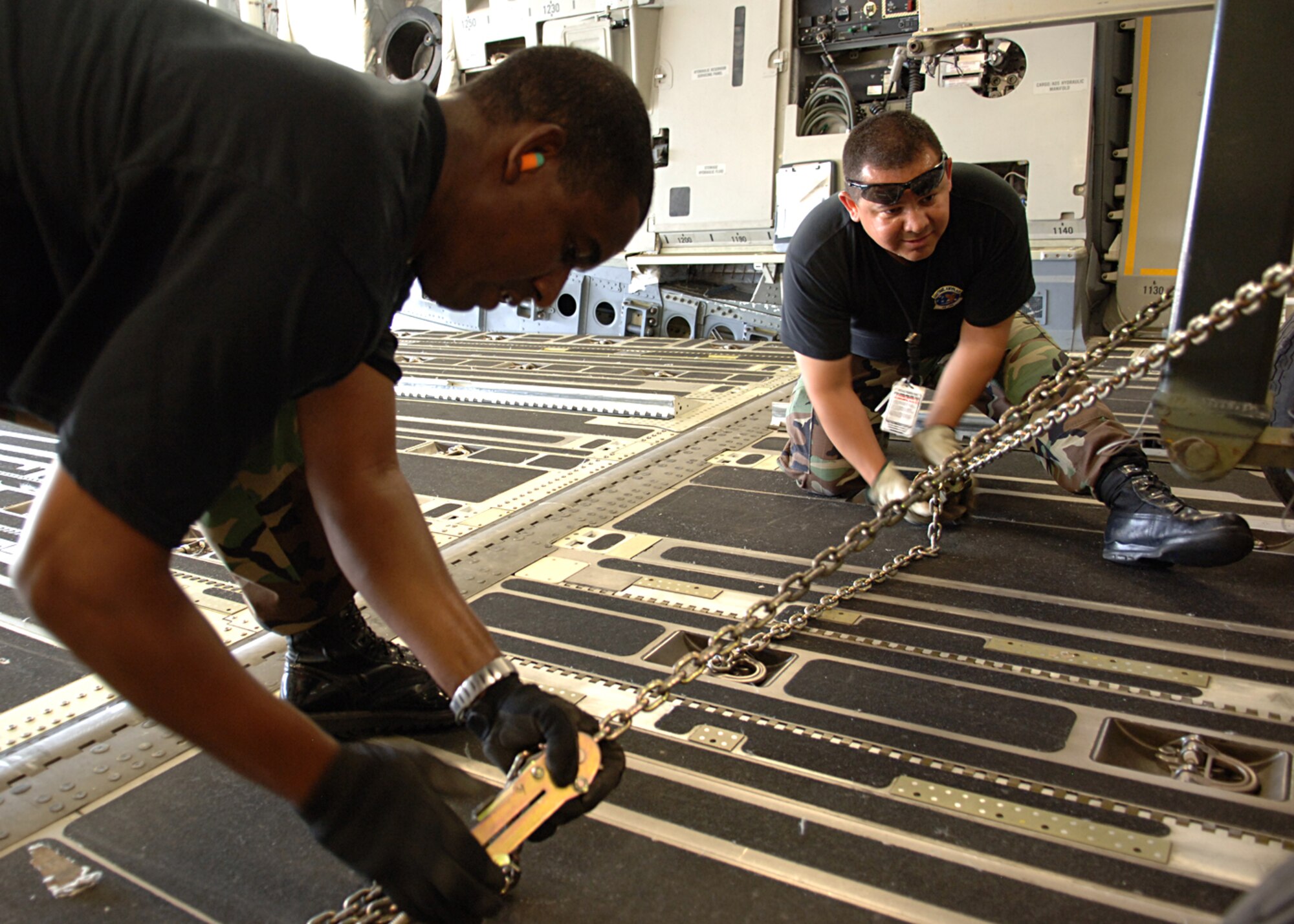 Tech. Sgt.'s Ramon Moss and Nolverto Nieto Jr., 49th Logistics Readiness Squadron, secure the last pieces of the F-117A at Holloman Air Force Base, N.M.   The last of the F-117A was sent to the U.S. Air Force Museum.  (U.S. Air Force photo by Airman 1st Class John D. Strong II)