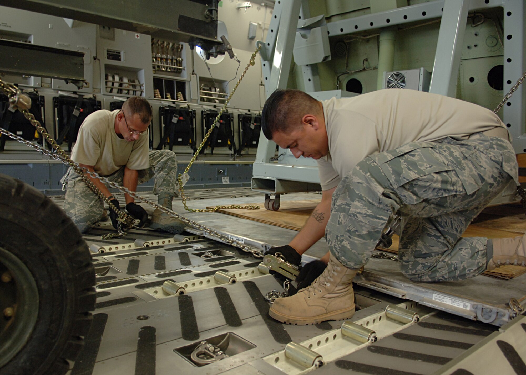 Staff Sgt.'s Julio Lopez and Marc Long, 49th Logistics Readiness Squadron, secure the cockpit of the F-117A at Holloman Air Force Base, N.M.   The F-117a's predecessor on Holloman is the F-22a raptor.  (U.S. Air Force photo by Airman 1st Class John D. Strong II)