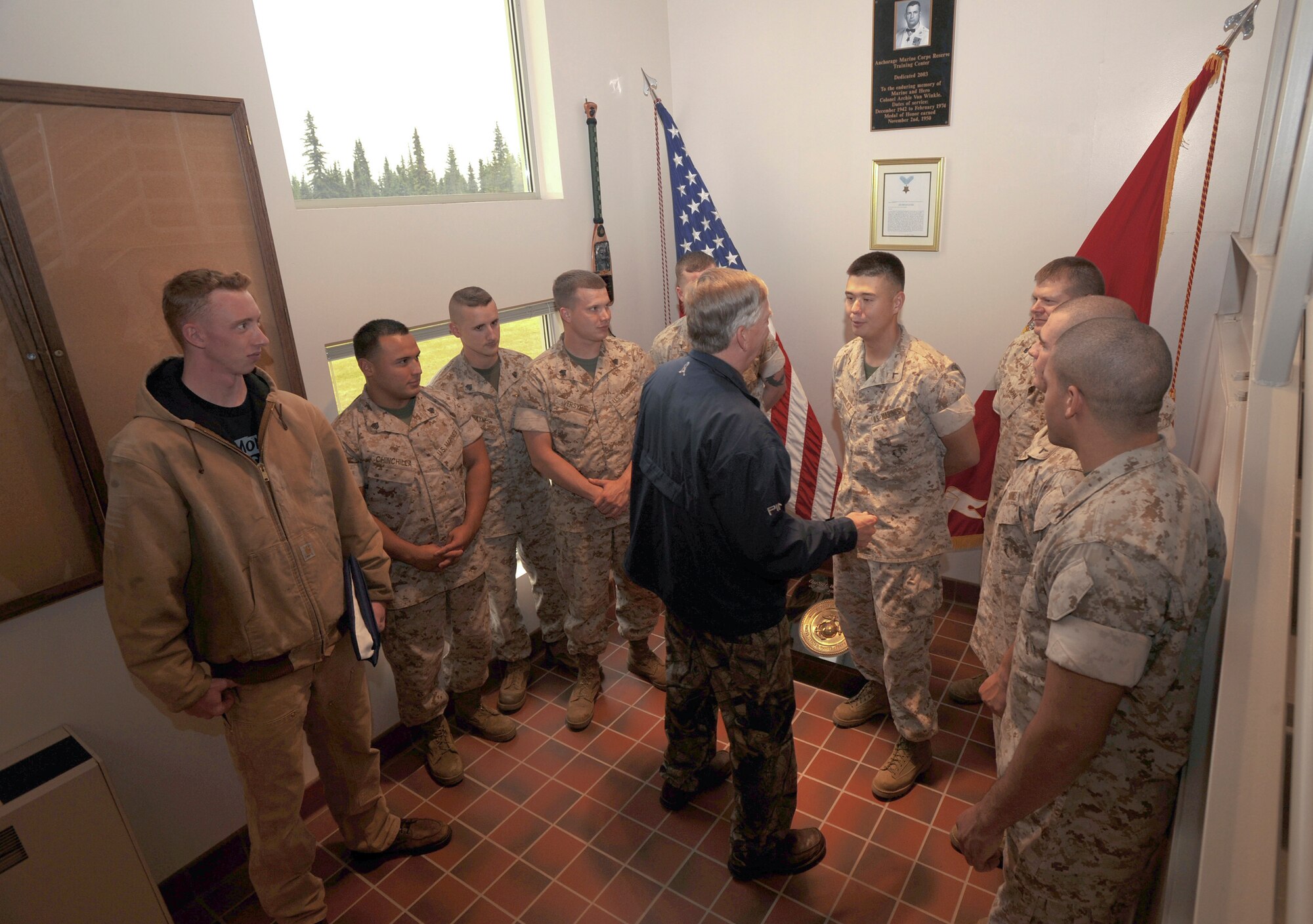 ELMENDORF AIR FORCE BASE, Alaska -- Alaska Senator Charlie Huggins greets the Marines at the Delta Company Anti-Terrorism Battalion, 4th Marine Division Sept. 12. Senator Huggins visited the Marines to present Lance Cpl. Charlie Stanton with a flag of appreciation for his service. (U.S. Air Force photo/Senior Airman Matthew Owens)