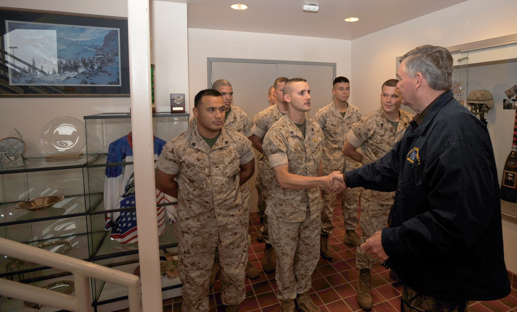ELMENDORF AIR FORCE BASE, Alaska -- Alaska Senator Charlie Huggins greets the Marines at the Delta Company Anti-Terrorism Battalion, 4th Marine Division Sept. 12. Senator Huggins visited the Marines to present Lance Cpl. Charlie Stanton with a flag of appreciation for his service. (U.S. Air Force photo/Senior Airman Matthew Owens)