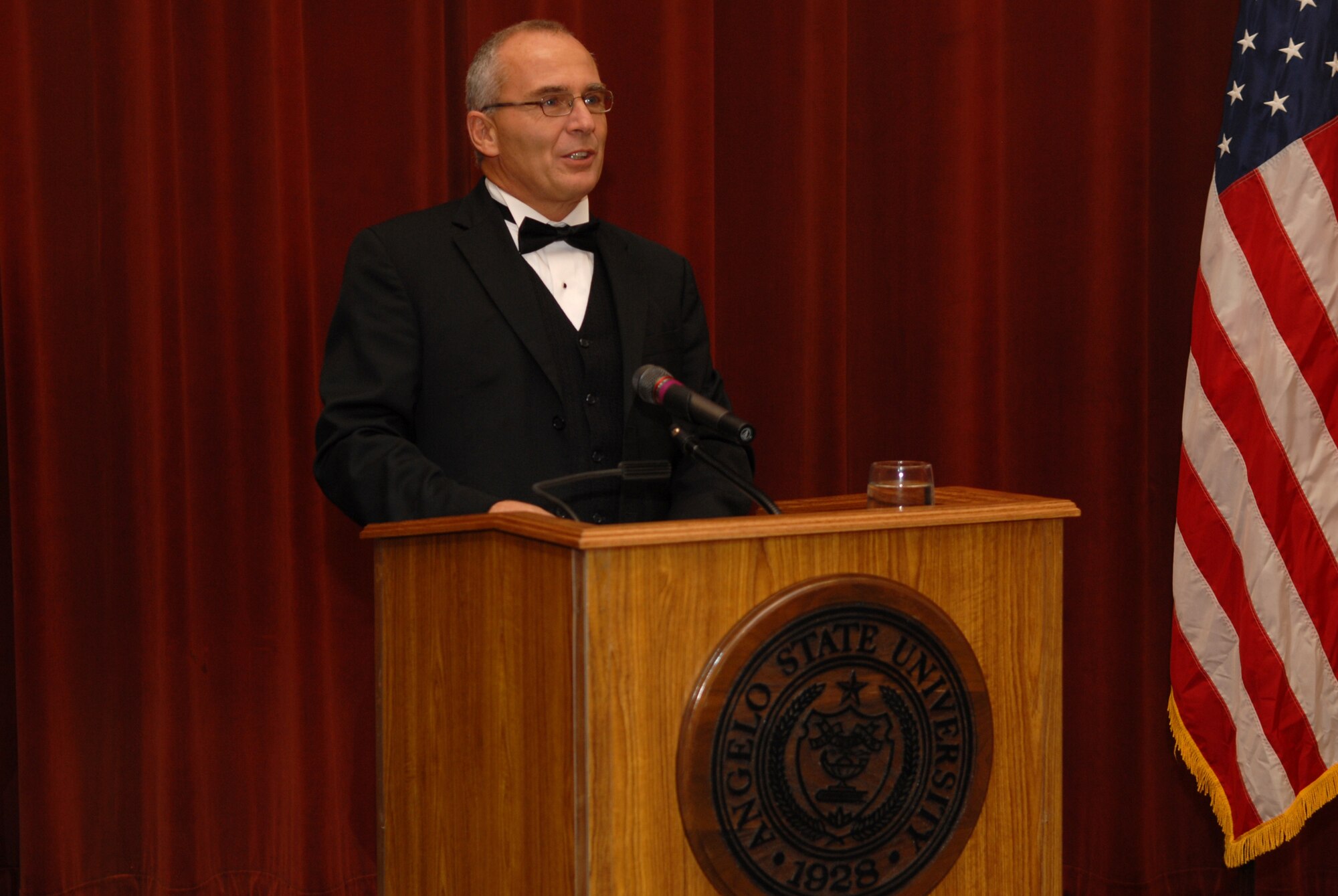Dr. John Garrett, 17th Training Wing historian, speaks at the 2008 Goodfellow Air Force Ball Sept. 12 at the C.J. Davidson Conference Center at Angelo State University. Dr. Garrett left Saturday for Germany. (U.S. Air Force photo by Senior Airman Kasabyan Musal)