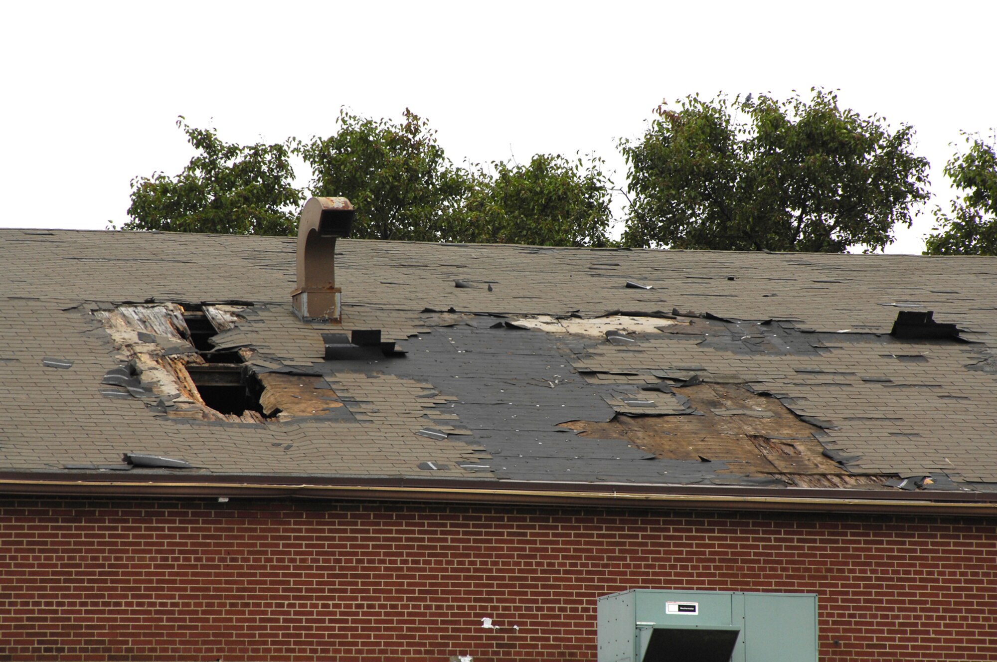 Building 17, a vacant facility in Wright-Patterson's Area B sustained significant roof damage during a Sept. 14 wind storm. Base civil engineers are assessing damage across the base after high winds from the remnants of Hurricane Ike knocked down trees and power lines.  (U.S. Air Force photo/Mike Libecap)