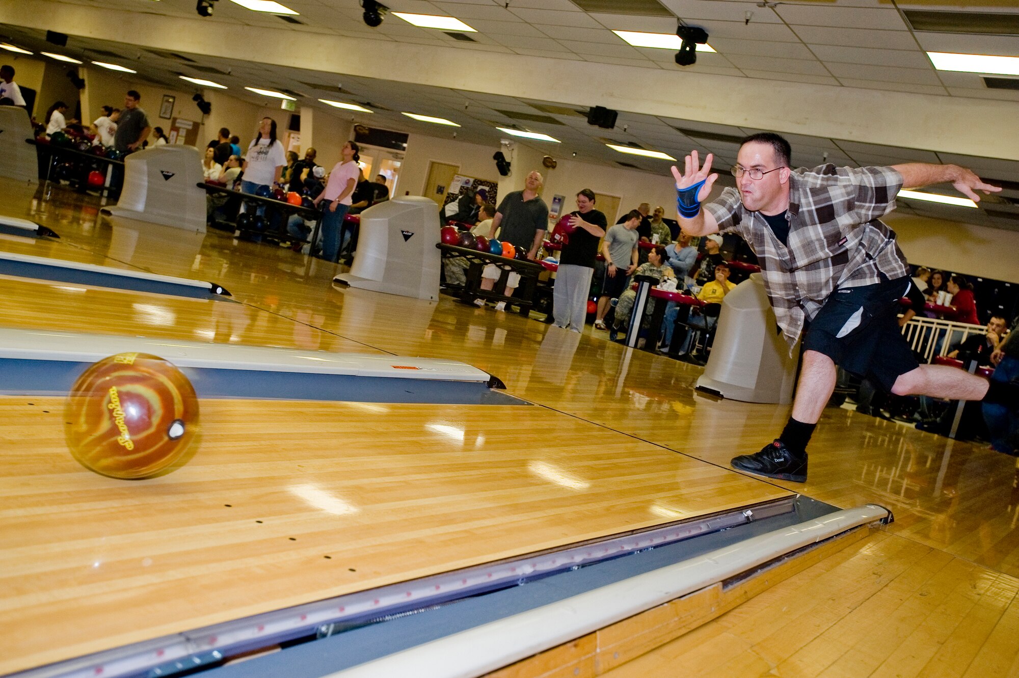 ELMENDORF AIR FORCE BASE, Alaska -- Staff Sgt. Floyd Fowler, 3rd Logistics Readiness Squadron, bowls for a strike during the opening day of the Intramural Bowling League. The league will continue on to early next year and is comprised of teams from squadrons across the base as well as Army units from Fort Richardson. (U.S. Air Force photo/Staff Sgt. Joshua Garcia)
