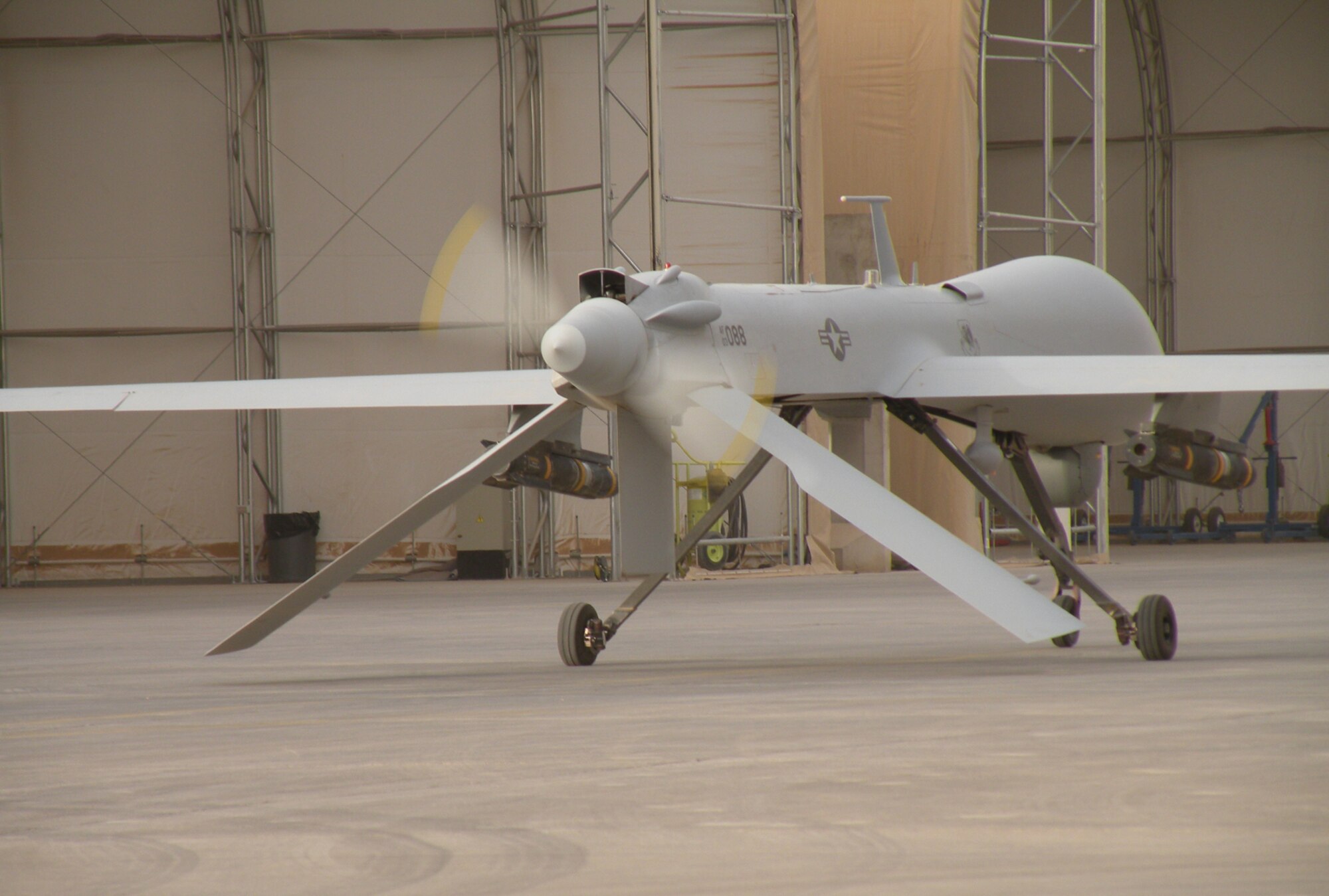 An MQ-1 Predator Unmanned Aircraft System idles at Joint Base Balad, Iraq, after returning from a mission in September, 2008. The Air Force is taking a new approach for developing pilots to sustain the fast-growing need for UAS capabilities. The MQ-1's primary mission is interdiction and conducting armed reconnaissance against critical, perishable targets. (U.S. Air Force photo/Staff Sgt. Scott Gaitley)