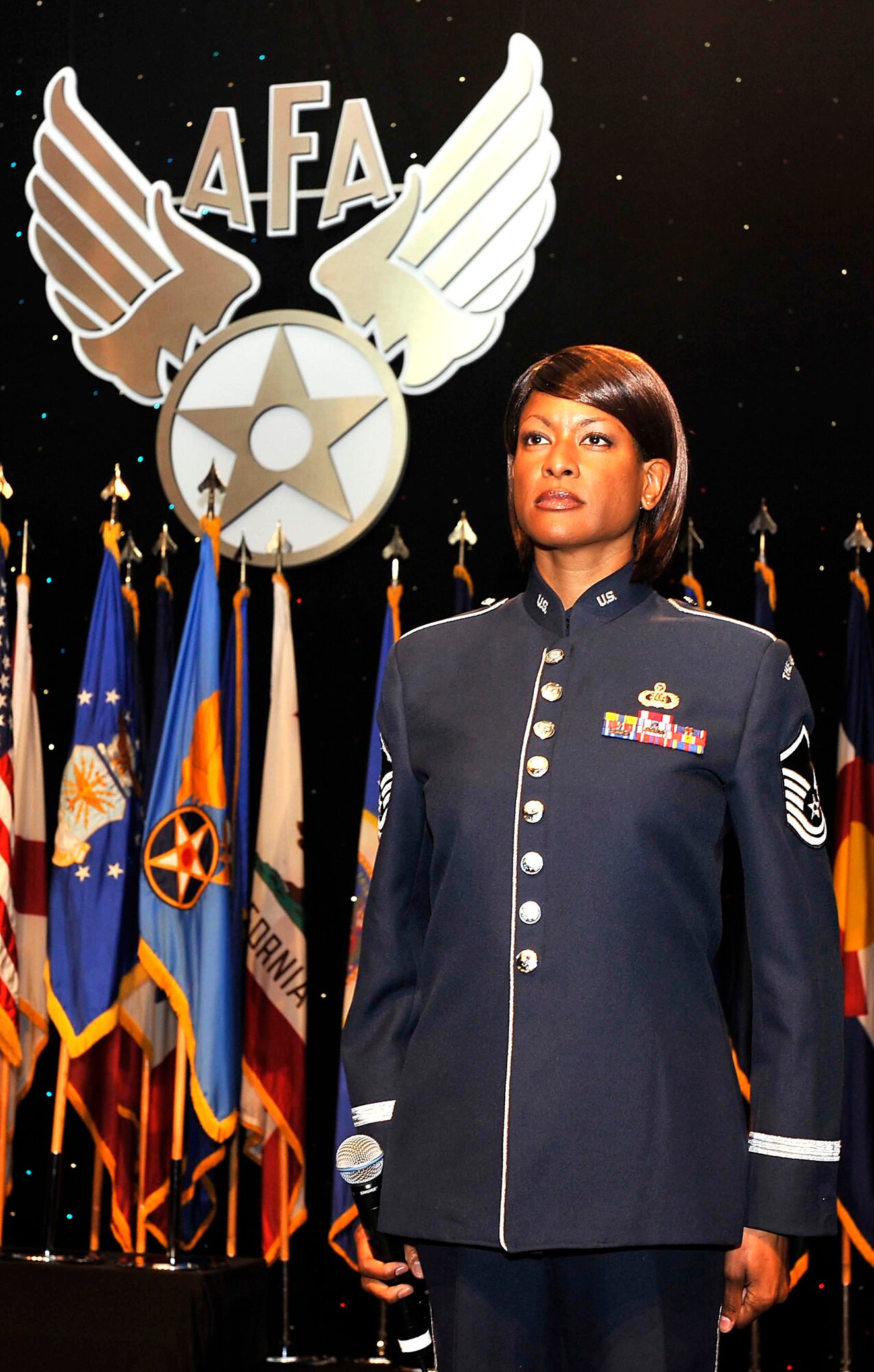 Master Sgt. Shanie Pruett sings the national anthem during the opening ceremonies of the 2008 Air Force Association Air & Space Conference and Technology Exposition Sept. 15 in Washington D.C.  Sergeant Pruett is from U.S. Air Force Band Singing Sergeants. (U.S. Air Force photo/Michael J. Pausic) 