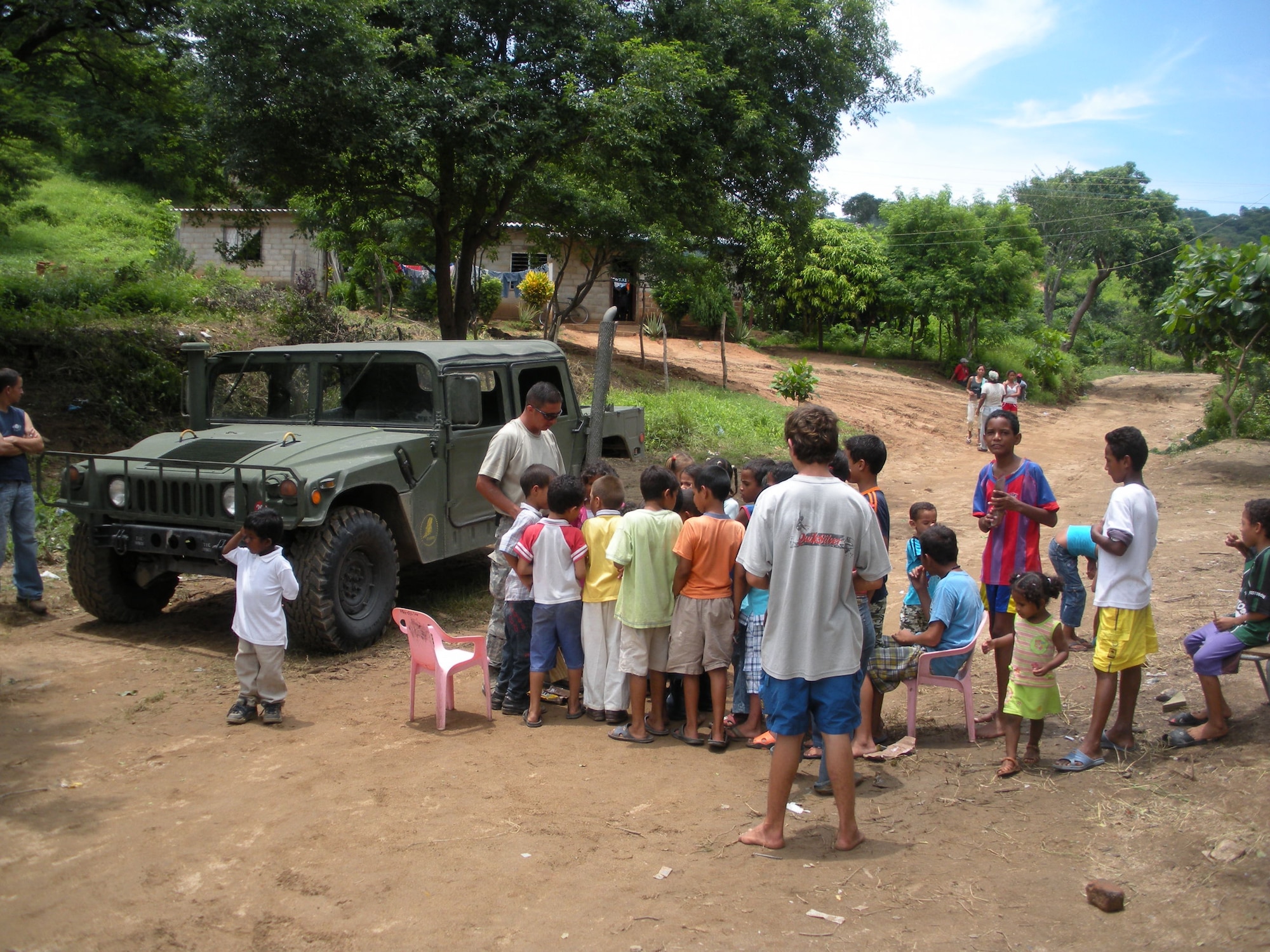 LOS ALPES, Colombia -- Staff Sgt. Richard Monsalve, 5th Civil Engineer Squadron heating, ventilation, air conditioning craftsman, spends time mentoring a group of children here recently while deployed in support of Continuing Promise 2008. CP 2008 is a collaborative effort between the United States and partner militaries, non-governmental organizations, and partner-nation support organizations to build strong partnerships that can be called upon in the event of a regional situation requiring cooperative solutions. (Courtesy photo)