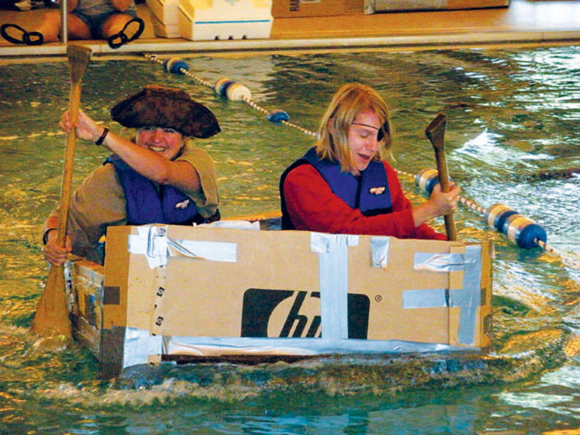 Dawn McCarty and Nicole Bejcek perform a demonstration ride at the aquatic center pool Saturday during the Build-a-Boat competition.