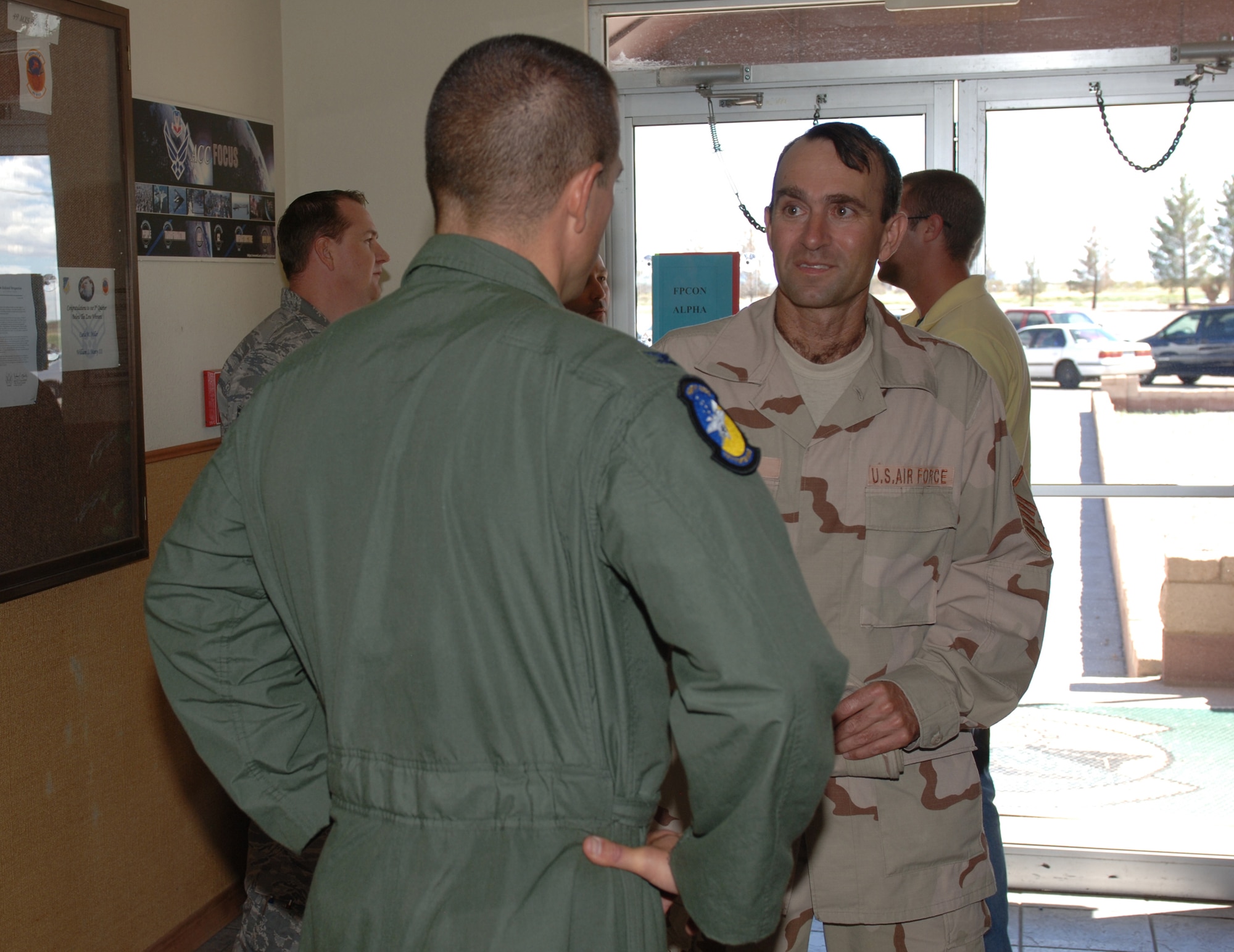 Master Sgt. Jeffery Sanders, 49th Maintenance Operations Squadron, is greeted by Col. Michael McGee, 49th Fighter Wing vice commander Sept. 12 at Holloman Air Force Base, N.M., after returning home from a four month deployment to Al Udeid Air Base, Qutar.  (U.S. Air Force photo/Airman 1st Class Michael Means)