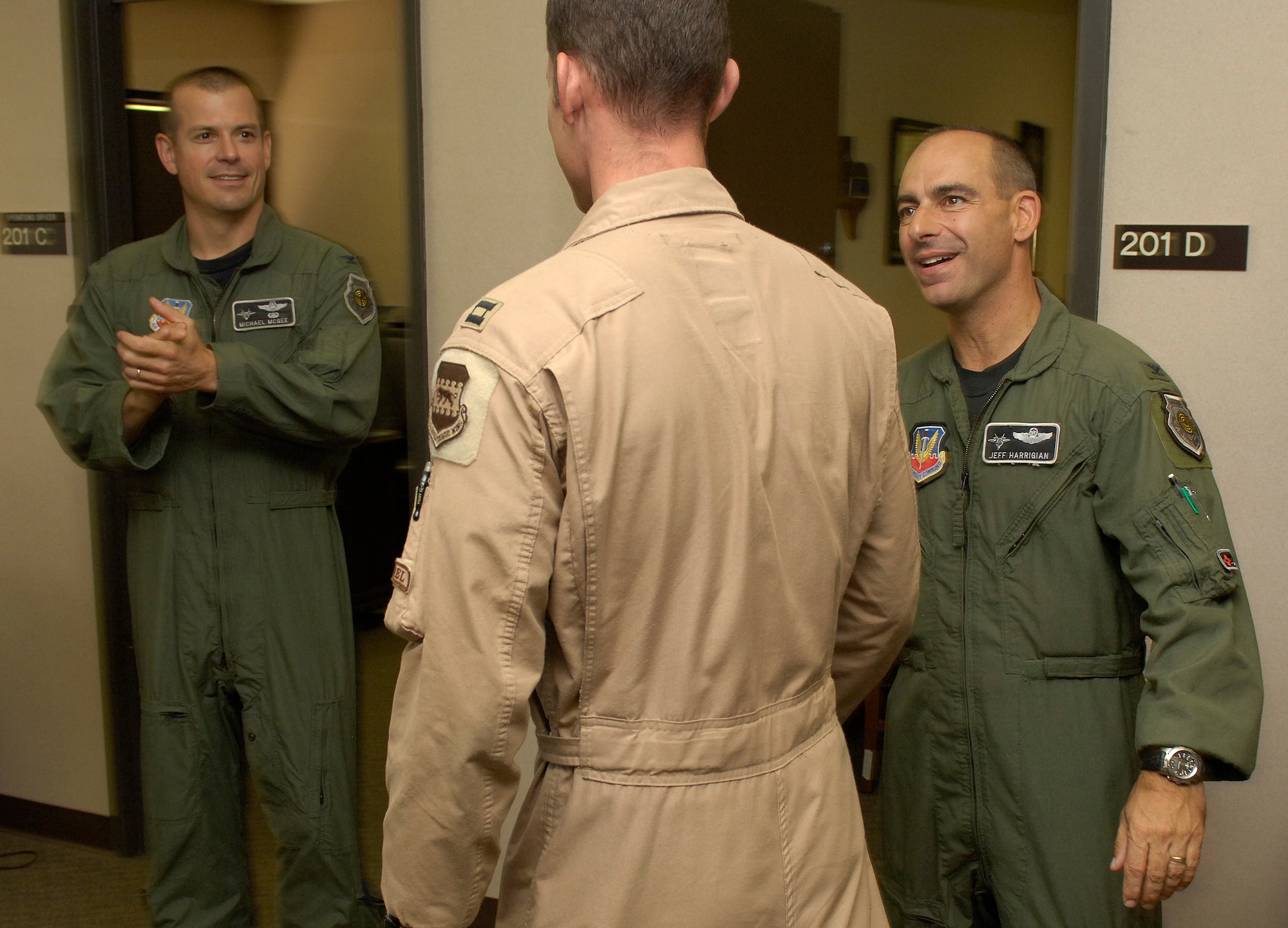 Capt. Michael Conrad, 49th Operations Group, is greeted by Col. Jeff Harrigian, 49th Fighter Wing commander and Col. Michael McGee, 49th Fighter Wing vice commander Sept. 12 at Holloman Air Force Base, N.M., after returning home from a 123 day deployment to Balad, Iraq. Captain Conrad was the 322 Expeditionary Operations Group executive officer. (U.S. Air Force photo/Airman 1st Class Michael Means)