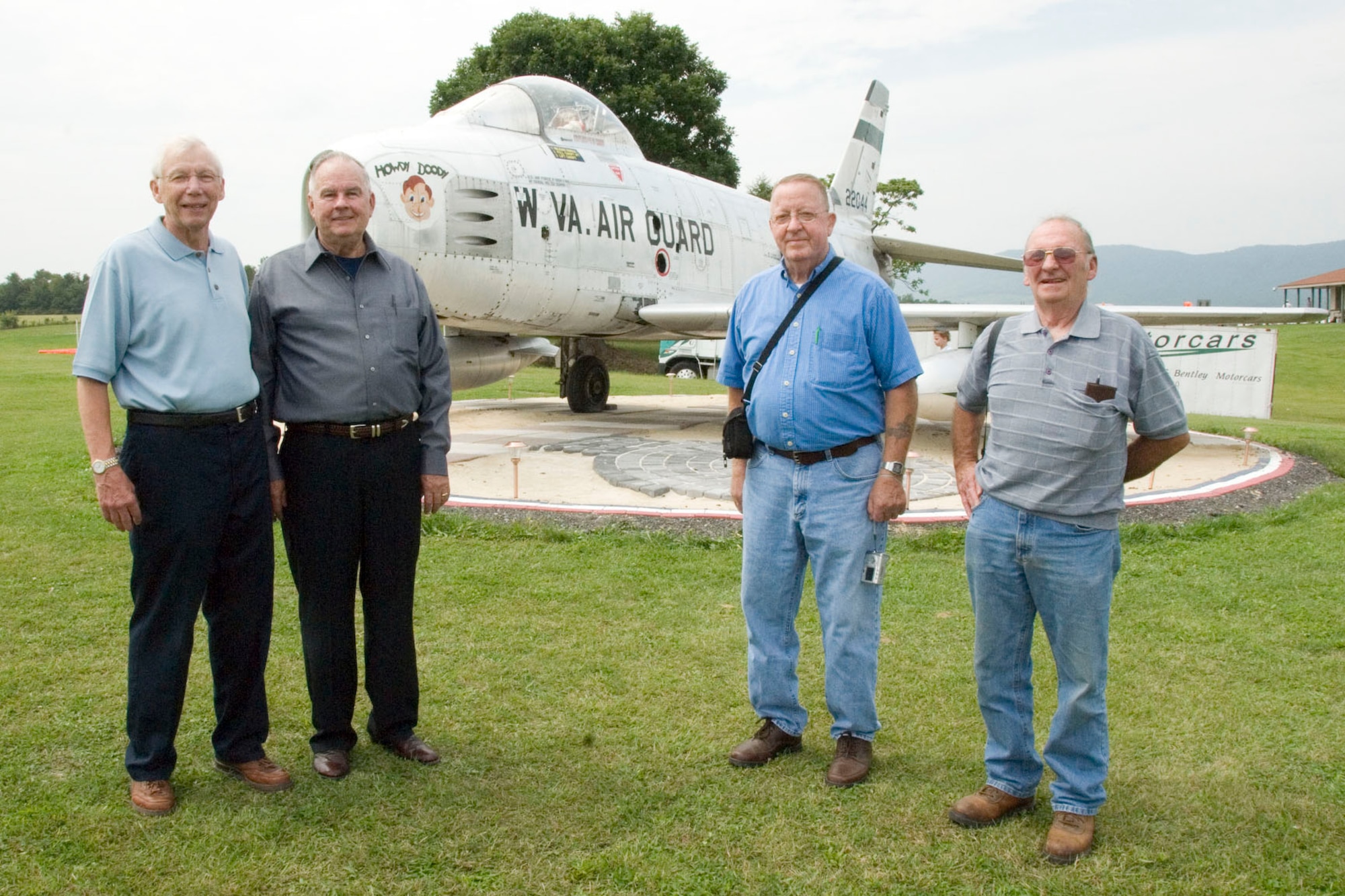 Al Ogden, Cecil Artrip, Donald Leight, and Kenneth Evans stand in front of a recently restored F-86H Sabre Jet before a restoration ceremony at the Front Royal Airport in Warren County, Va. Ogden, a retired major from the 167th Airlift Wing, piloted the aircraft while it was assigned to the unit. Artrip, also retired from the 167th Airlift Wing, was the jet's crew chief. Leight and Evans are also retired crew chiefs from the 167th Airlift Wing. Artrip, Leight, and Evans are credited with the restoration of the aircraft which is now on display at the entrance to the Front Royal Airport.