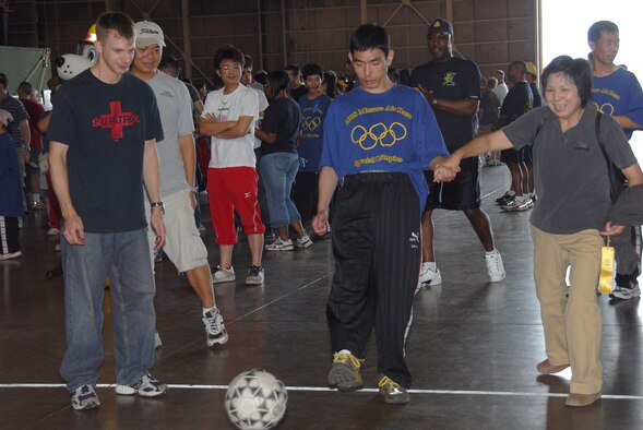 MISAWA AIR BASE, Japan -- Kazunari Abe, Kakehashi-Ryo School, kicks a soccer ball during the Misawa Air Base Special Olympics Sept. 13. The soccer kick was one of the many games available. (U.S. Air Force photo by Senior Airman Laura R. McFarlane) 