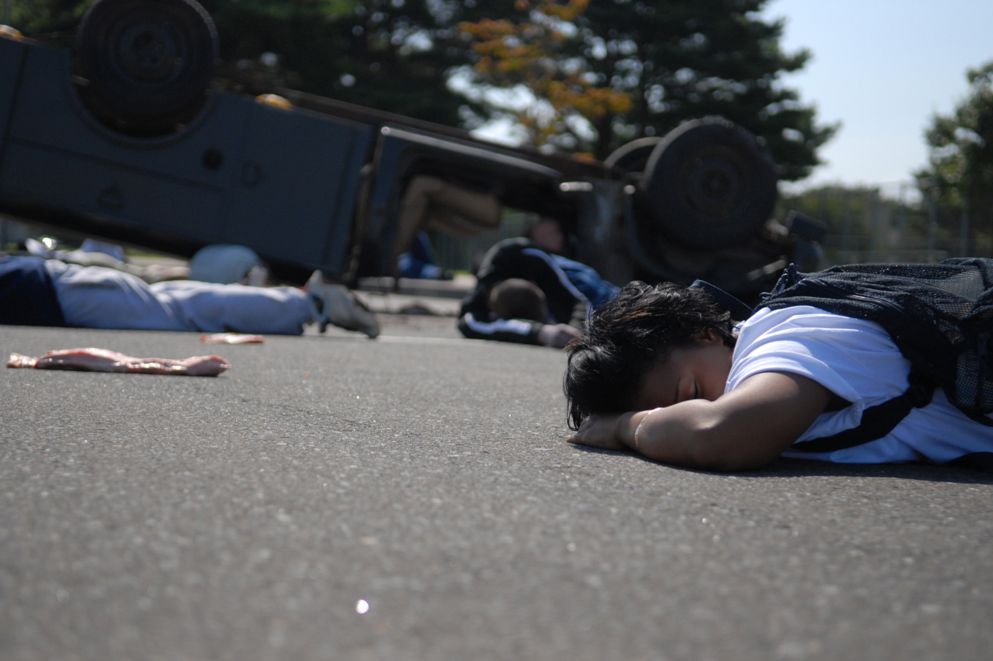 MISAWA AIR BASE, Japan -- Victims await medical attention after a simulated propane explosion during an emergency management exercise Sept. 16, 2008. There were 15 volunteers who played victims during the exercise. (U.S. Air Force photo by Airman 1st Class Jamal D. Sutter)