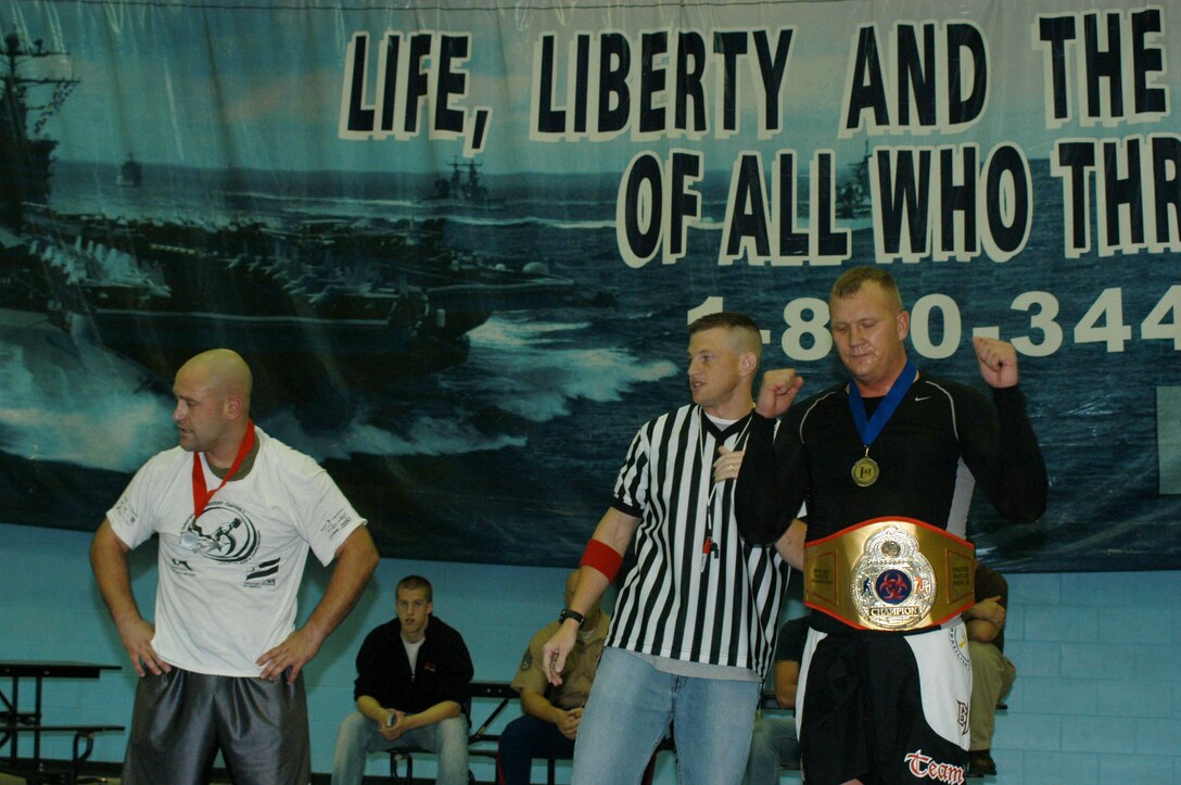 Sgt. Jeff Nielson is awarded the victory in the Devil Dog Fighting Championship. Capt. Brandon Cooley, instructor-inspector for Engineer and Maintenance Co., started the tournament when the Marines at the reserve station asked to learn more about grappling.