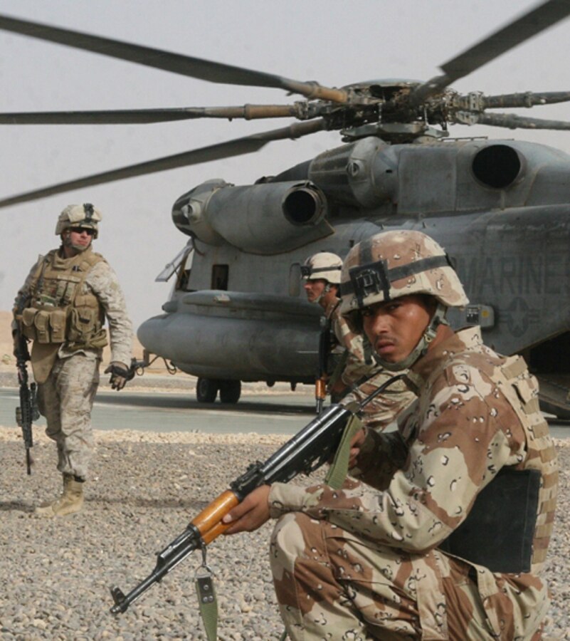 An Iraqi Army soldier provides security during a rehearsal for an upcoming mission with Company F, Task Force 2nd Battalion, 2nd Marines, Regimental Combat Team 5 at Combat Outpost Rawah, Iraq, Sept. 16. Iraqi Army personnel operated as part of the assault element for a repeat mission alongside Marines of Co. F.