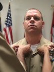 Navy Chief Petty Officer Larry Pieper at Chemical Biological Incident Response Force donned his khakis at a ceremony here. Pieper is a religious program specialist at CBIRF.