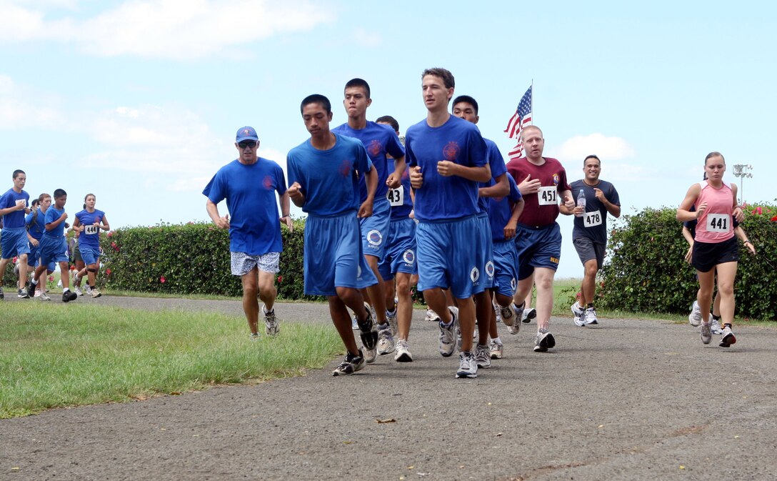 Cadets from the Kalaheo High School Navy junior reserve officer training  corps run in formation during the 12th Annual 5K Grueler Sept. 17.
