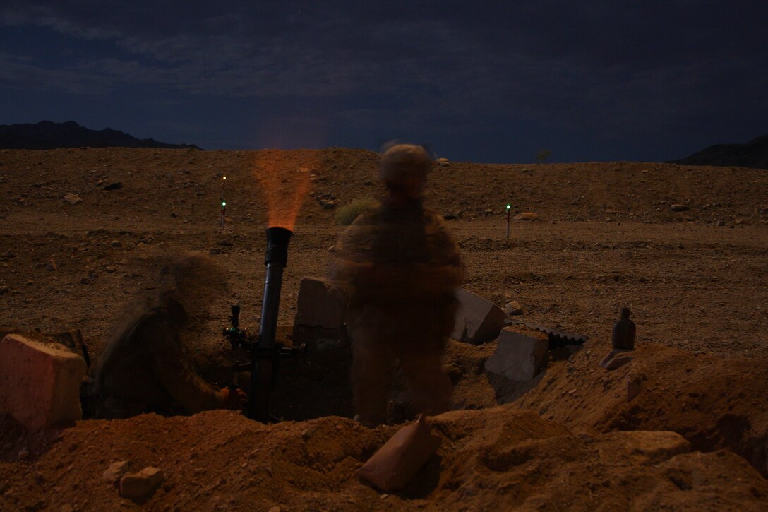 Mortar Marines with 3rd Battalion, 8th Marine Regiment’ Company L, perform fire missions during a mock Taliban ambush prior to the company calling in rotary and fixed wing air strikes during an Afghanistan-centered Mojave Viper at the Combat Center Sept. 17.