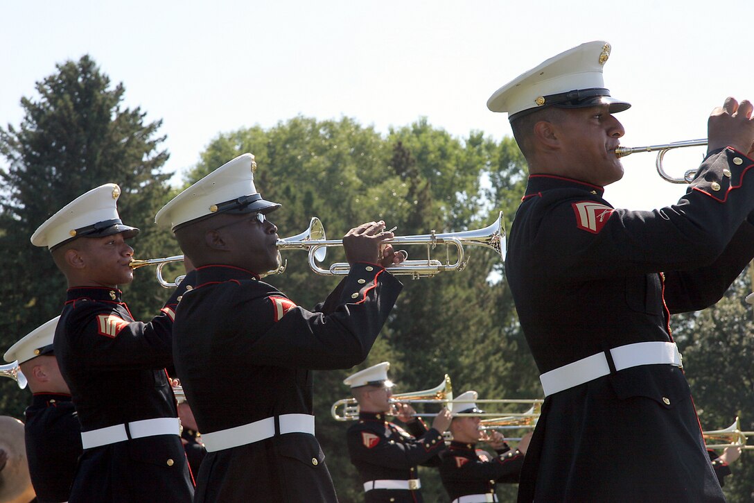 Trumpet players with the MCAGCC 29 Palms Band play in formation for students of Southwest High School in Green Bay, Wis., Sept. 17.  The band conducted nearly 20 performances at 13 venues throughout the state during their week long tour in Wisconsin in support of Recruiting Station Milwaukee.