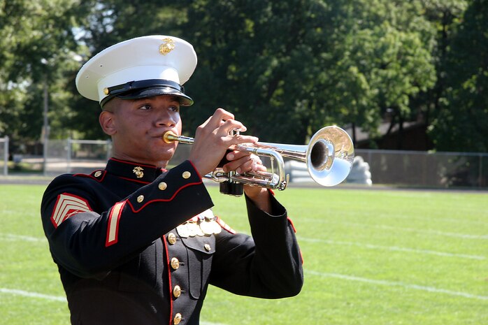 Sergeant Alan Phillips, a trumpet player with the MCAGCC 29 Palms Band, performs a solo for the students of Southwest High School in Green Bay, Wis., Sept. 17.  The band conducted nearly 20 performances at 13 venues throughout the state during their week long tour.