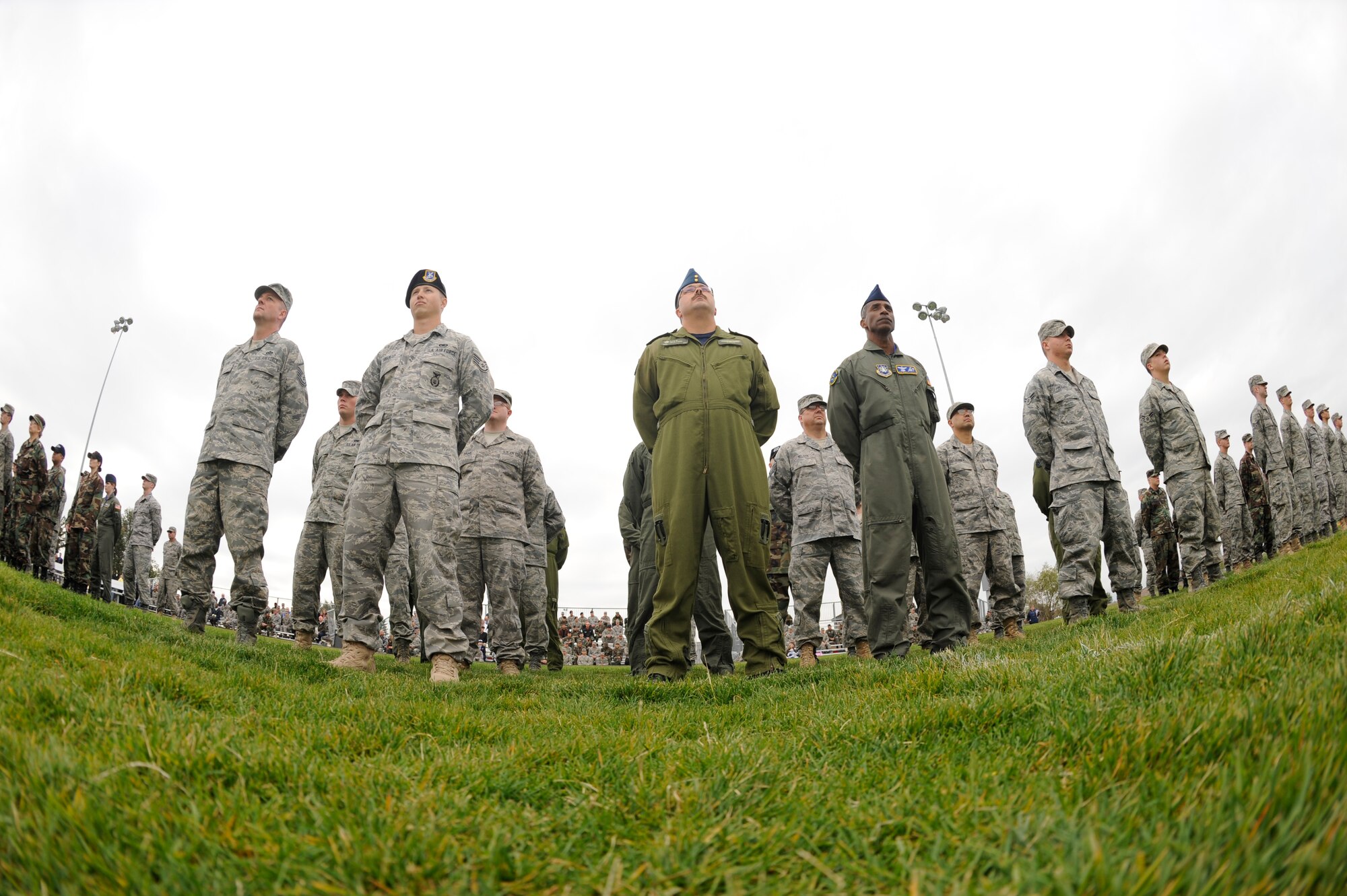 BUCKLEY AIR FORCE BASE, Colo. -- Members of Team Buckley stand in formation at the base running track, Sept. 11, as the base paid tribute to those who lost their lives on Sept. 11, 2001. (U.S. Air Force photo by Airman 1st Class Christopher Bush)